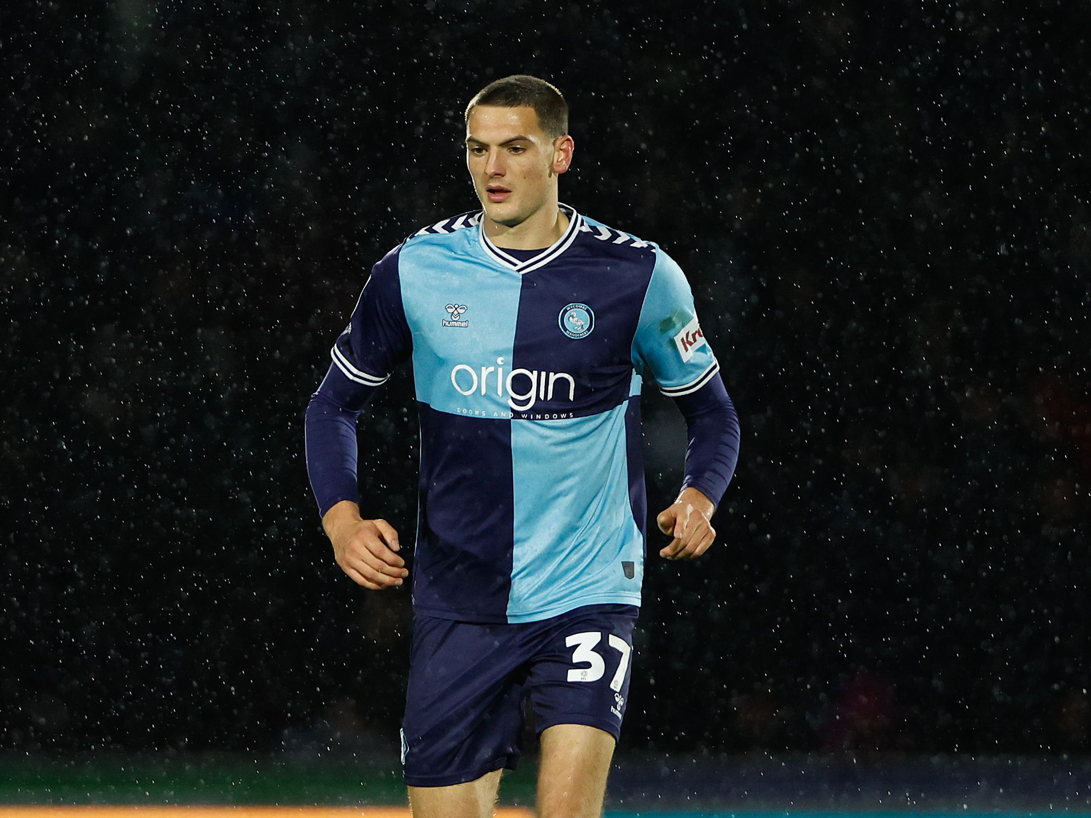 Caleb Taylor in action for Wycombe Wanderers in their home kit 