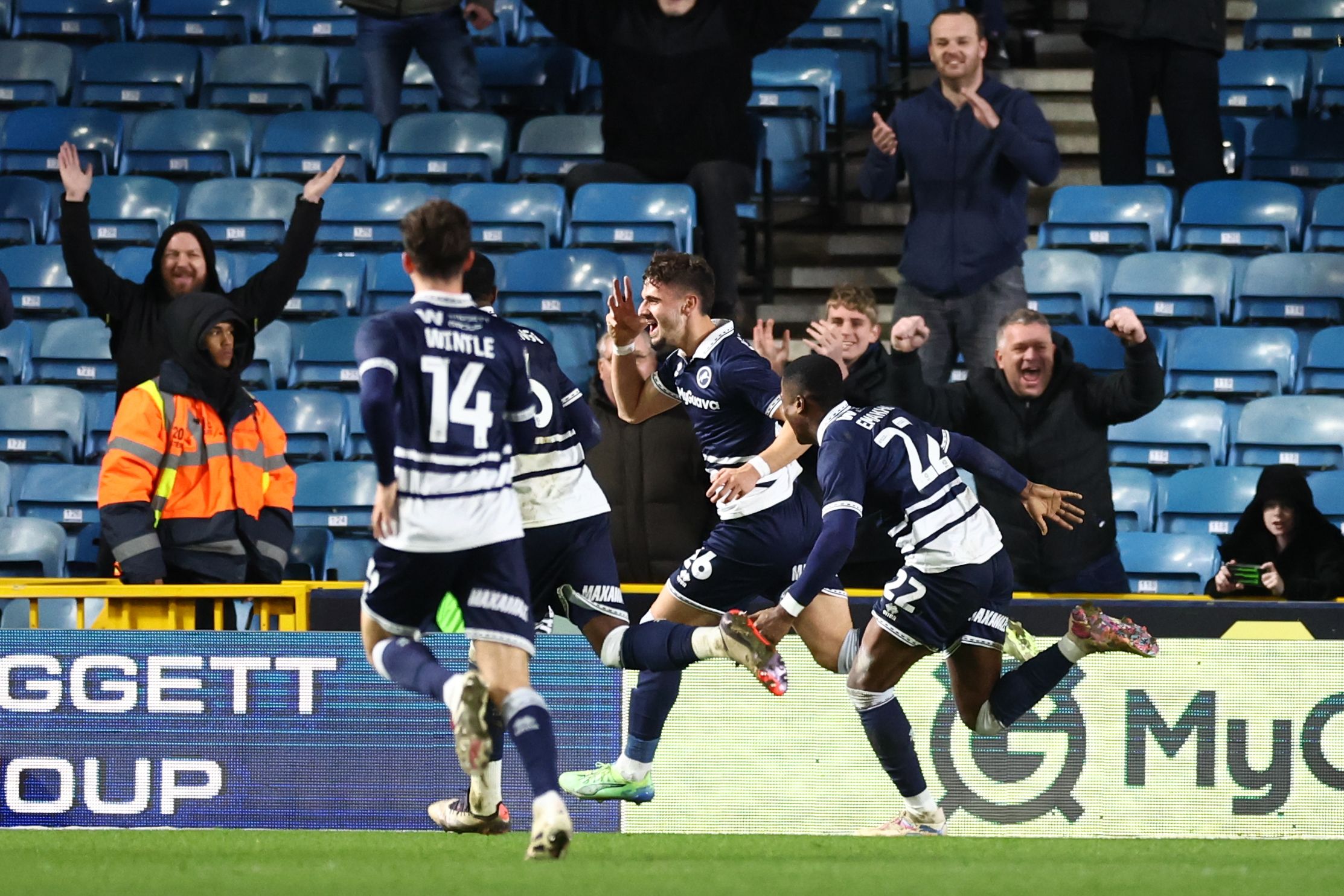 Several Millwall players celebrating a goal scored in their home kit 