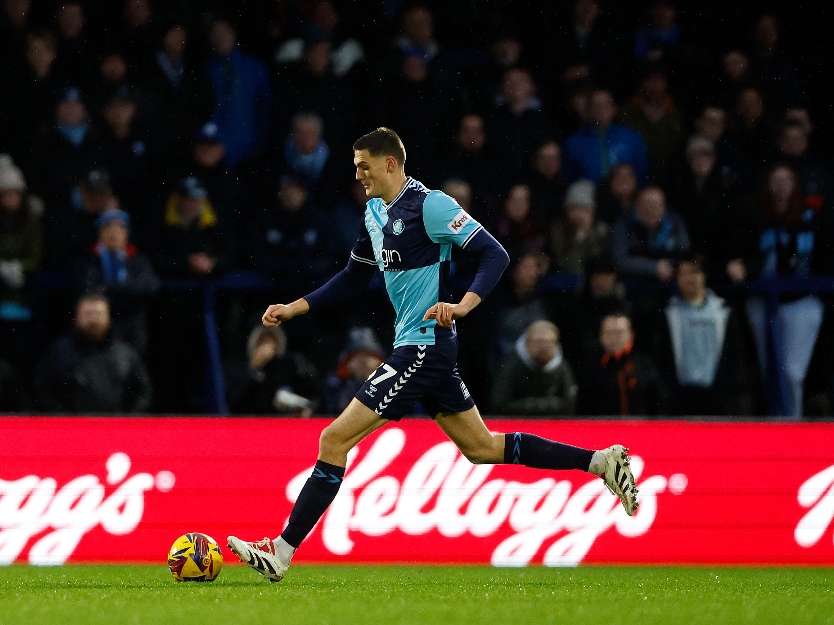 Caleb Taylor in action for Wycombe Wanderers in their home kit 