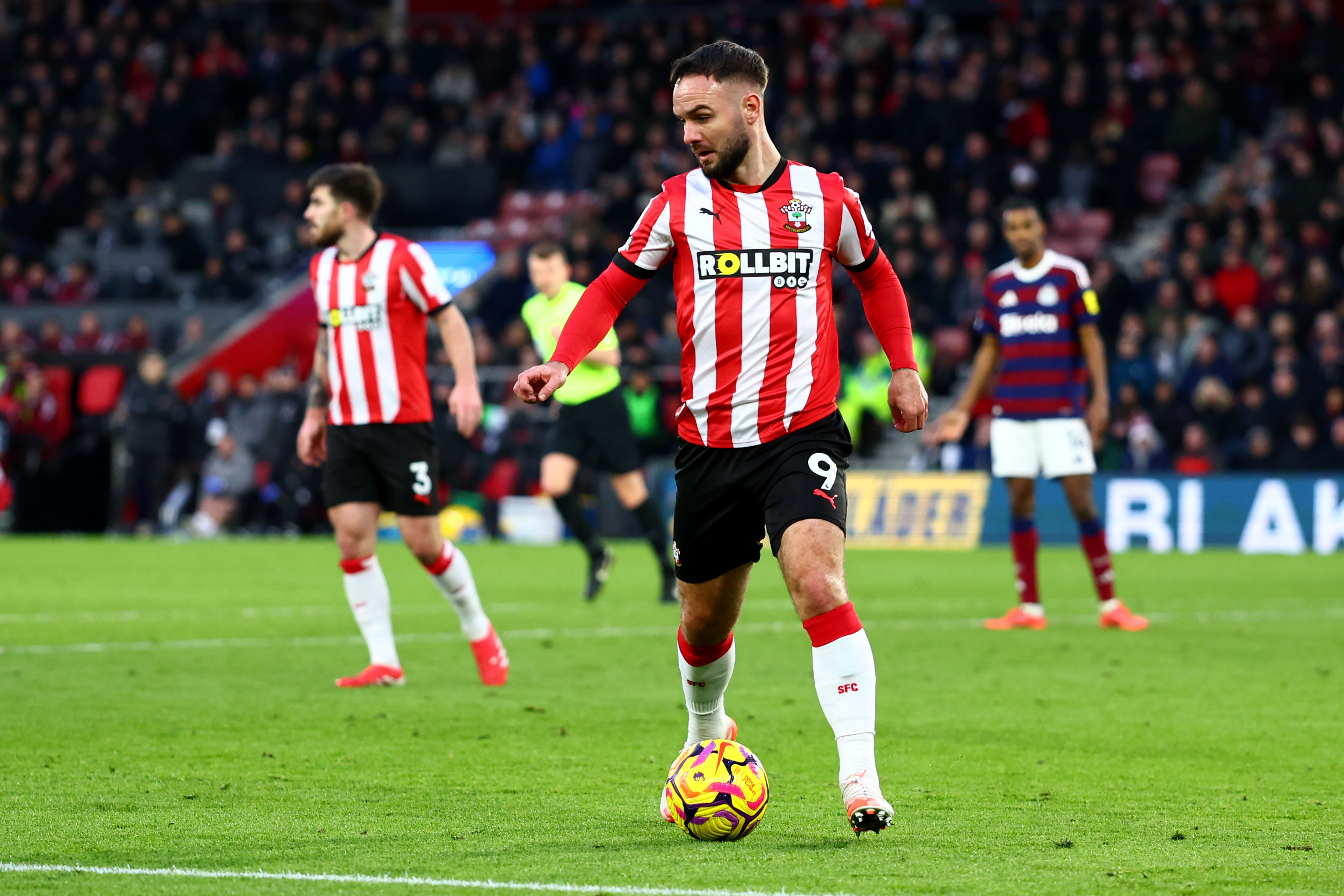 Adam Armstrong in action for Southampton in their home kit 