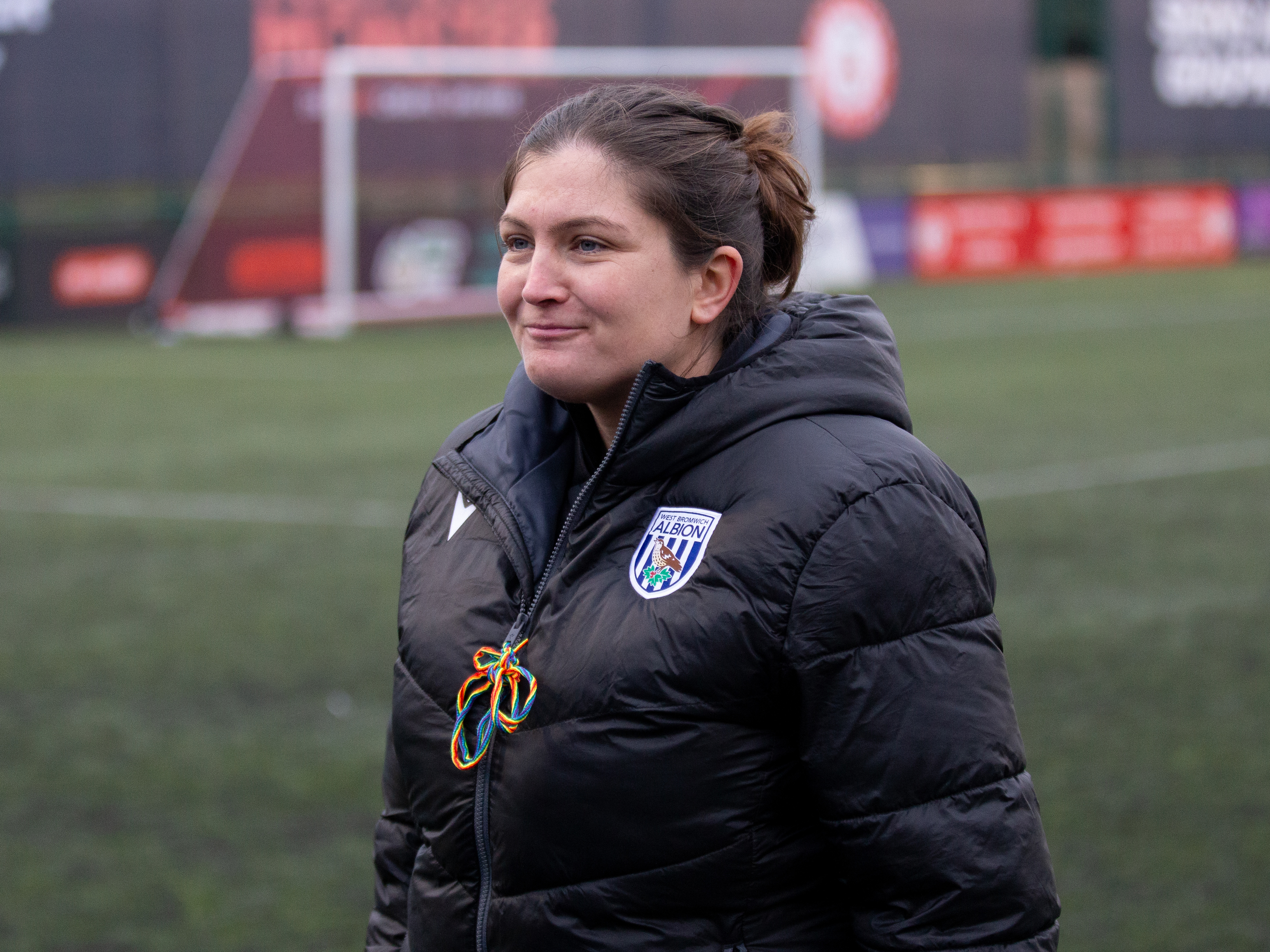 An image of Siobhan Hodgetts-Still smiling after her team's win against Aston Villa