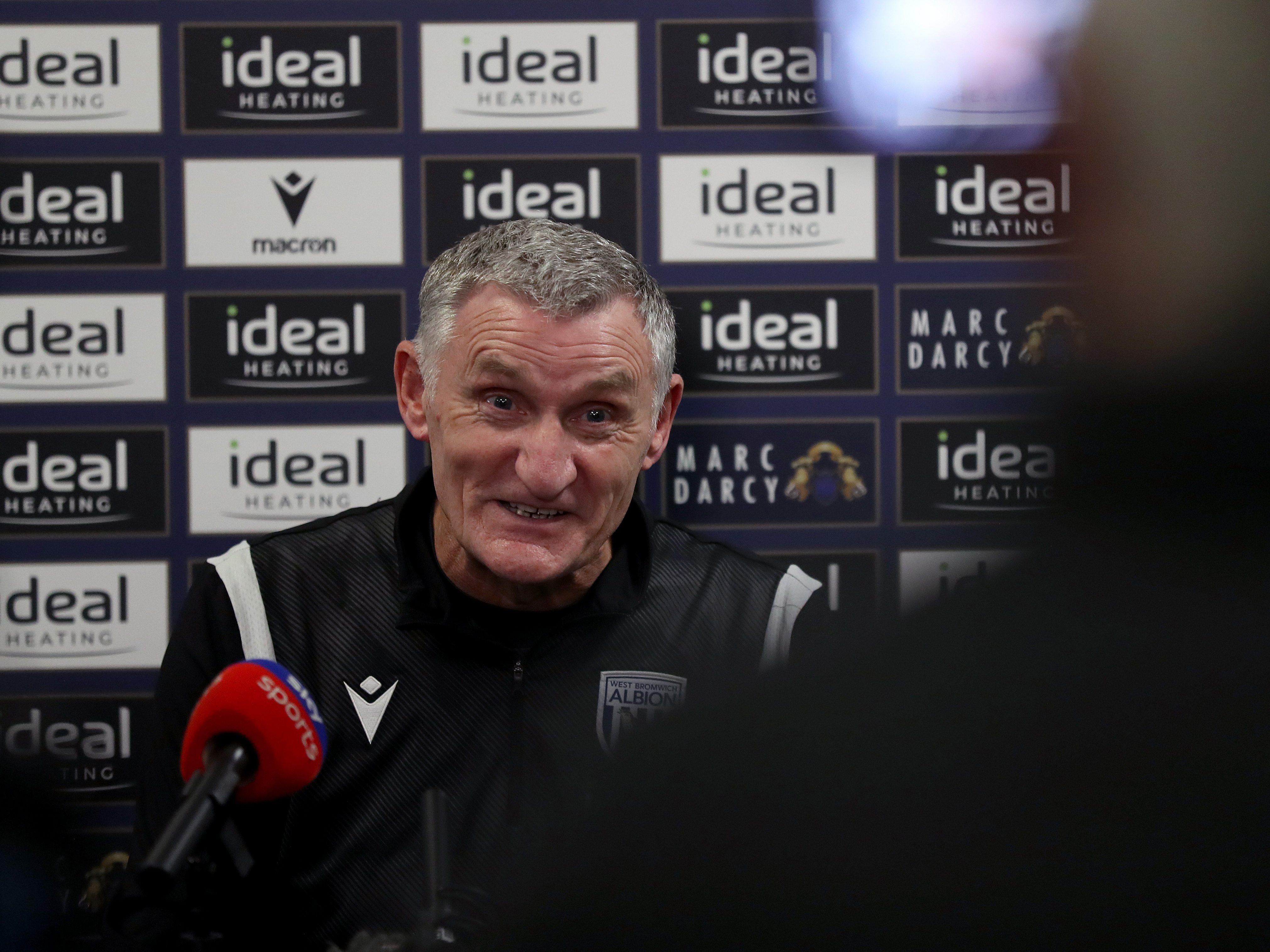 An image of Tony Mowbray talking to the press