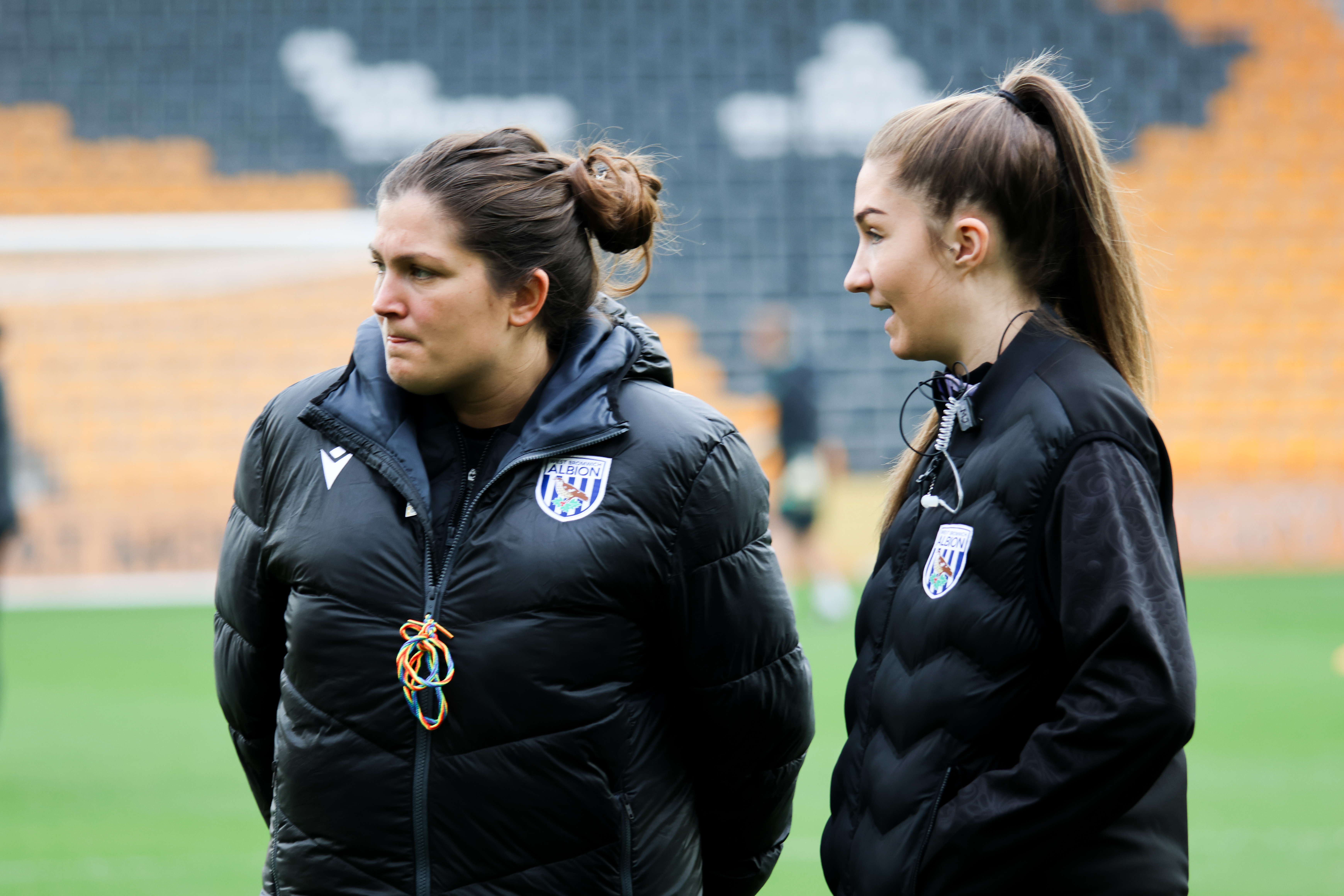 Siobhan Hodgetts-Still on the side of the pitch at Molineux with a member of her coaching team