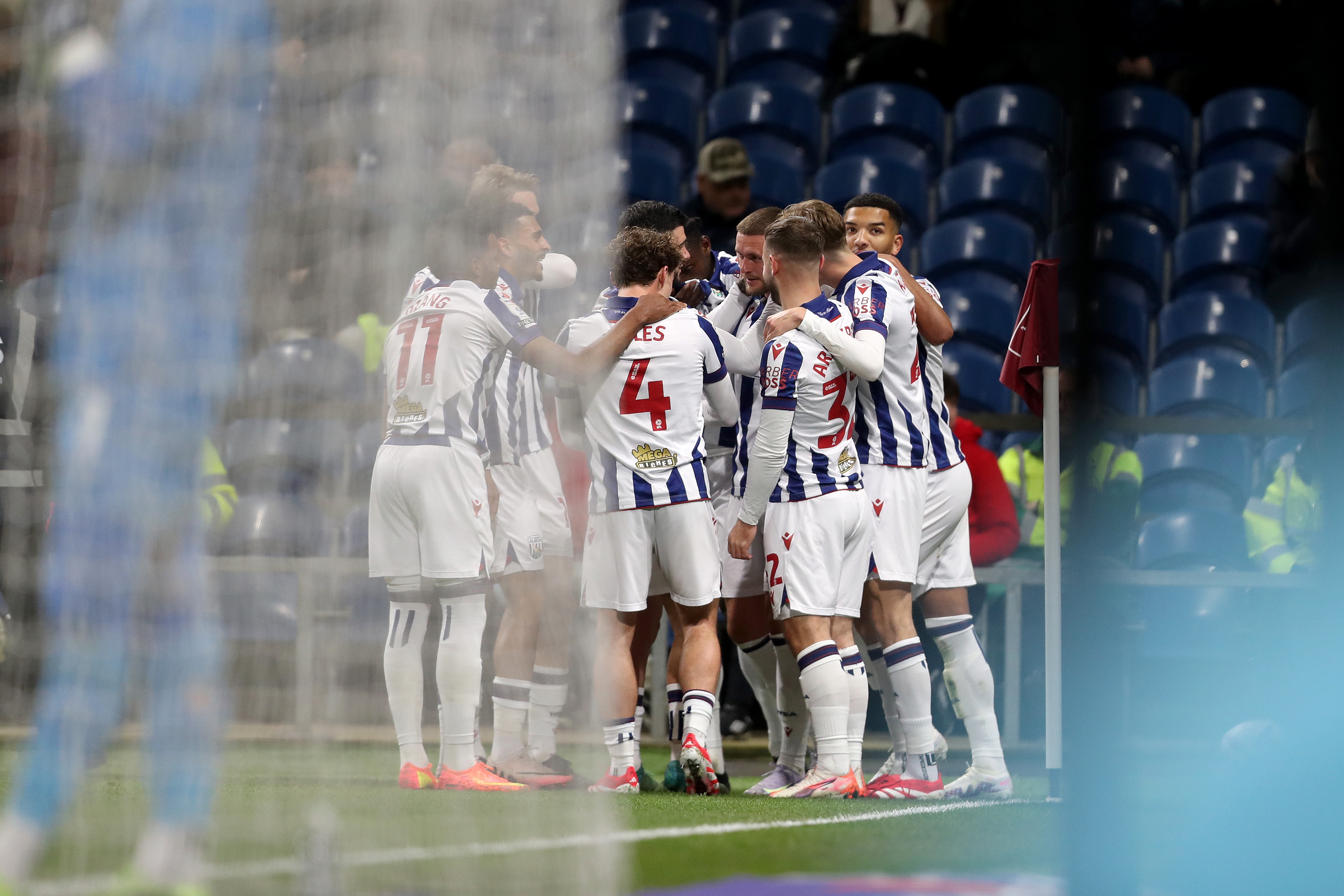 John Swift celebrates scoring a free-kick at Burnley with team-mates