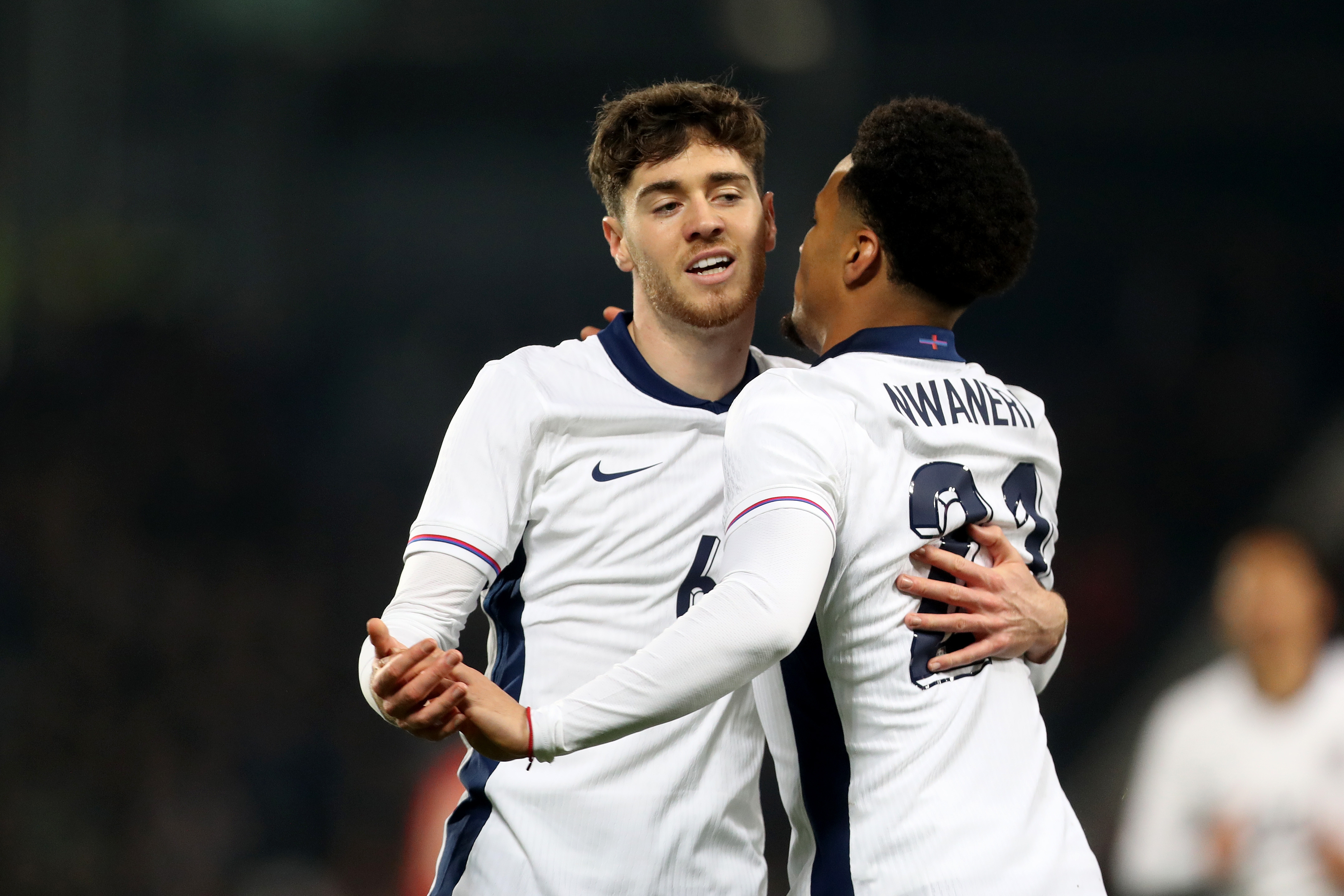 Two England players celebrate a goal scored against Portugal at The Hawthorns