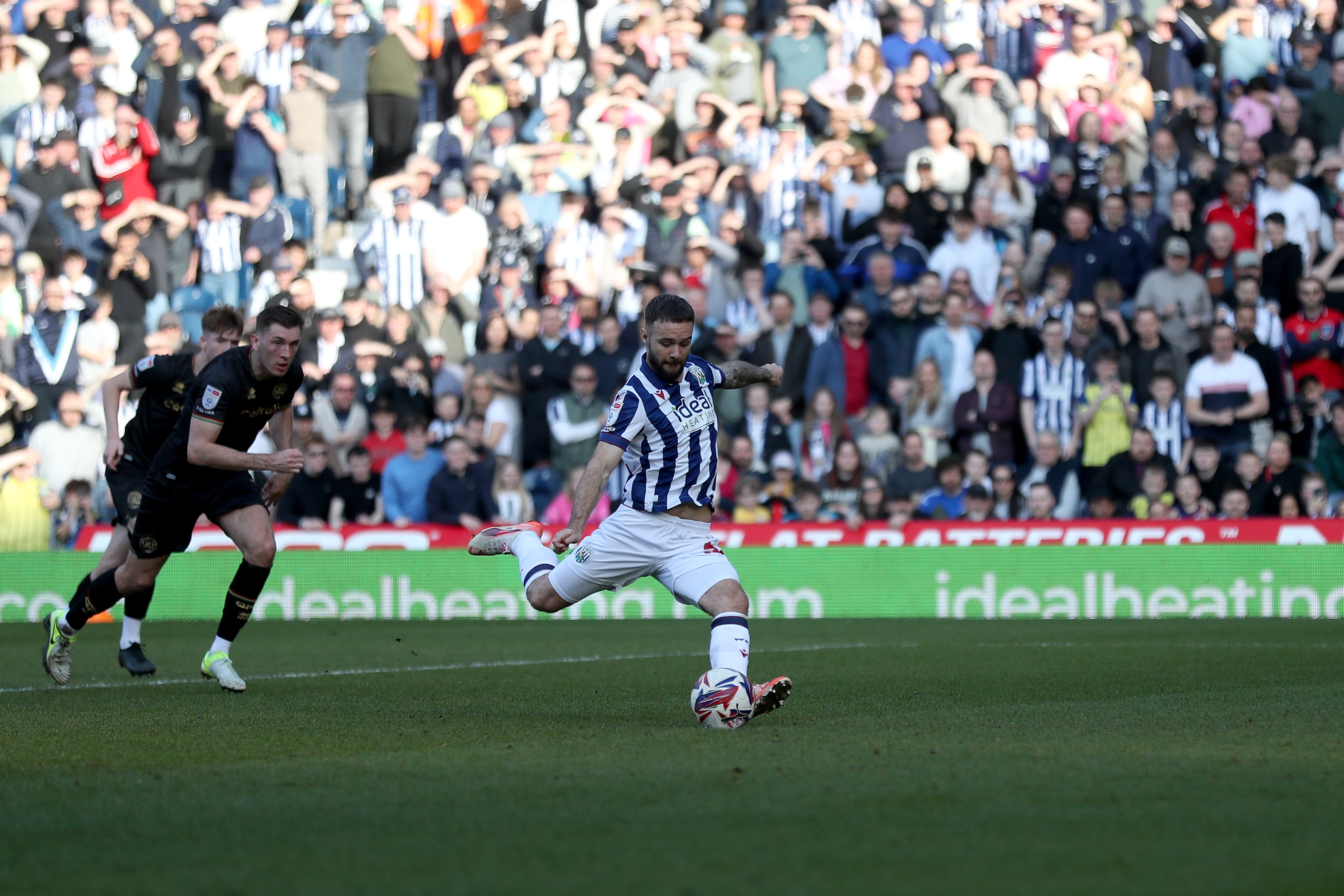 Adam Armstrong takes a penalty against QPR 