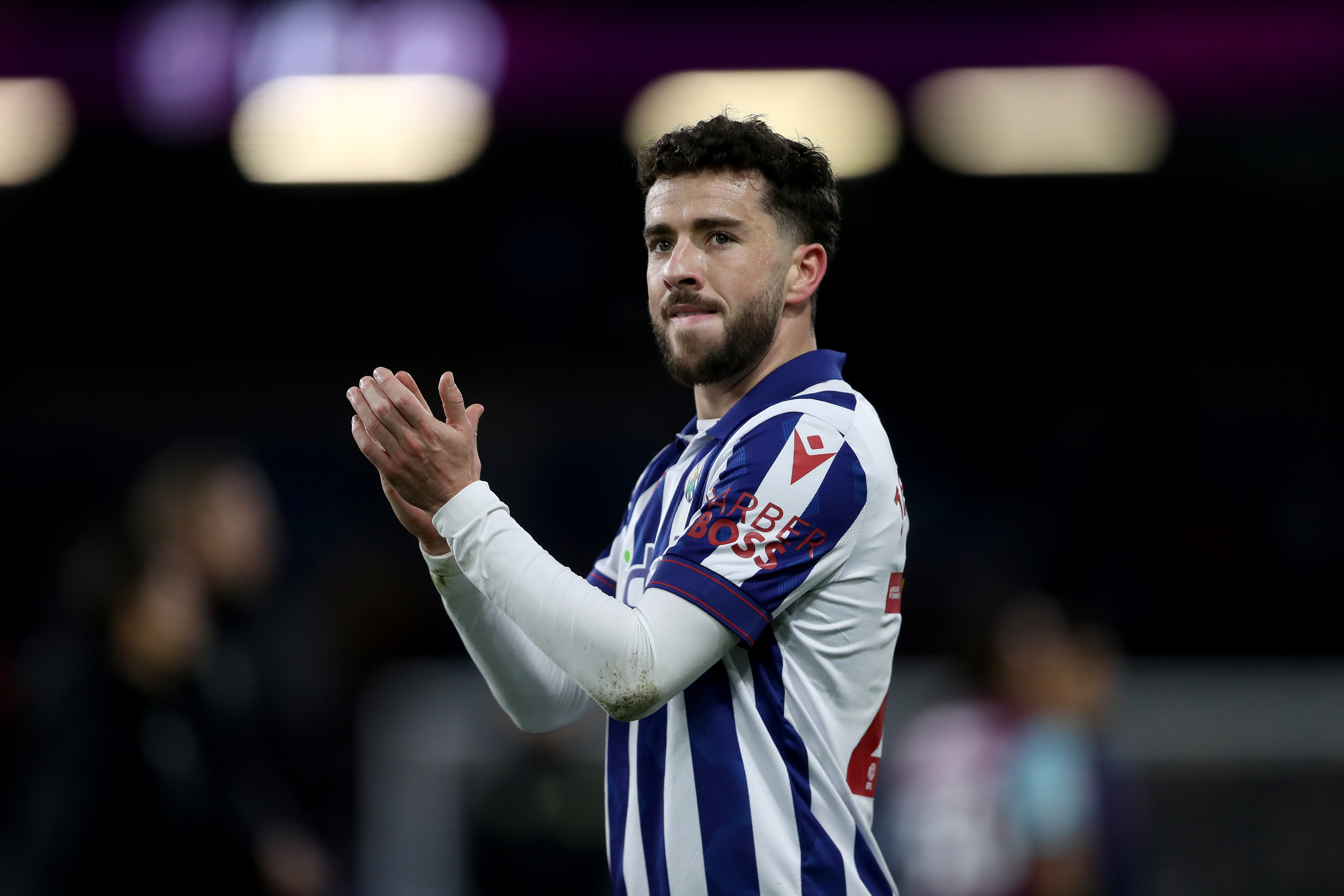 Mikey Johnston applauding Albion fans after the game at Burnley