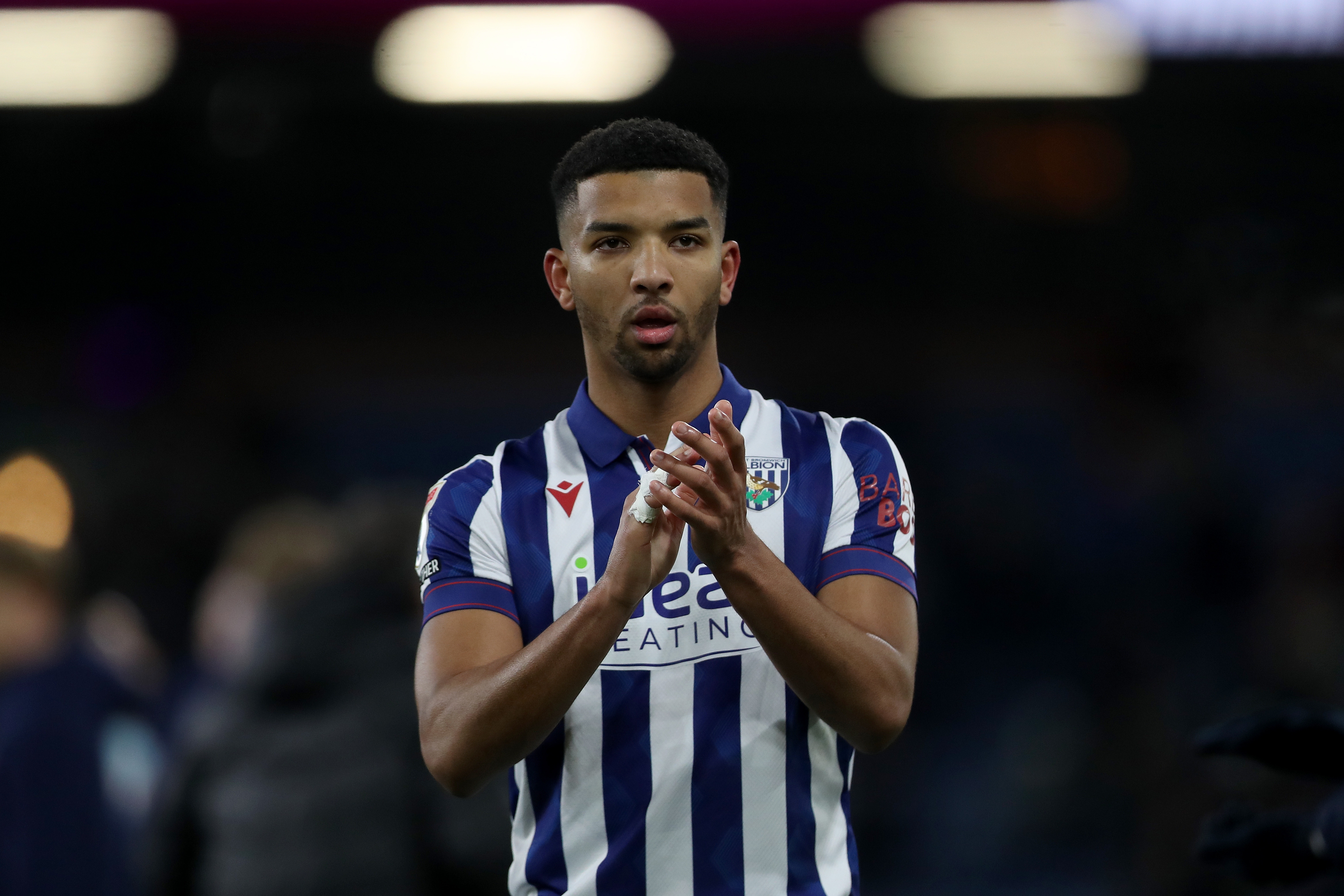 Mason Holgate applauding Albion fans after the game at Burnley