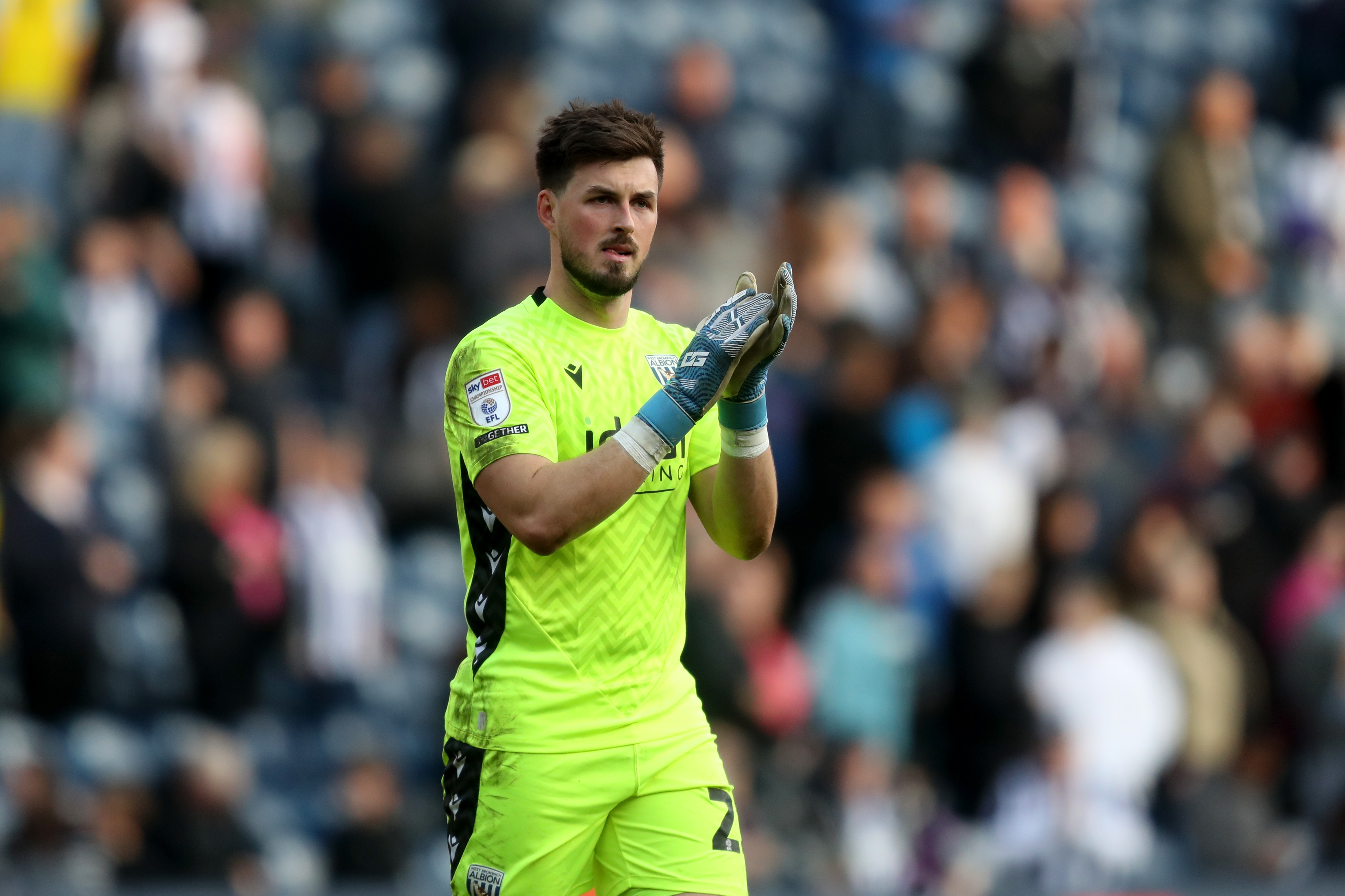 Joe Wildsmith applauds Albion fans after the QPR game