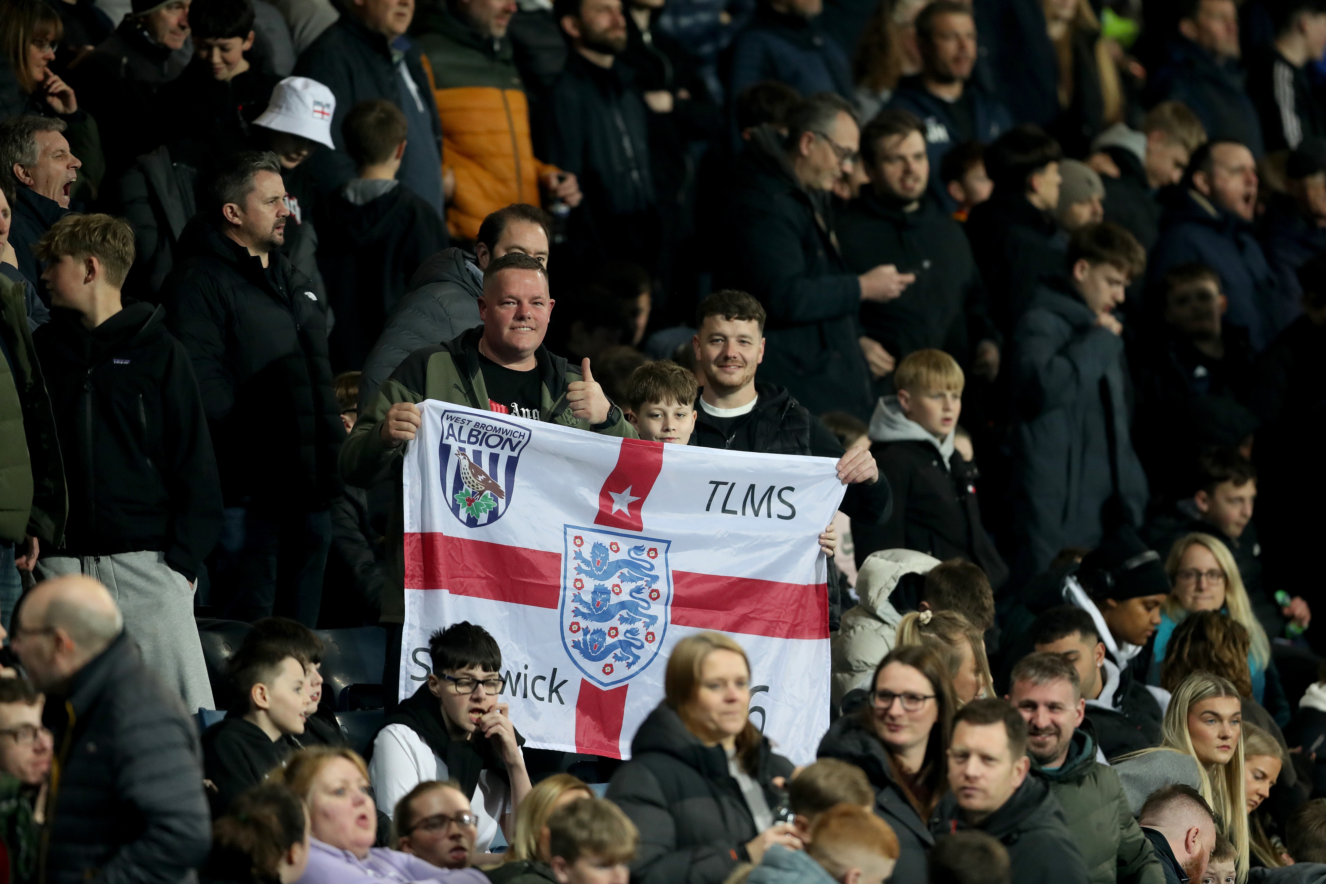 England fans in the stands at The Hawthorns with England flags