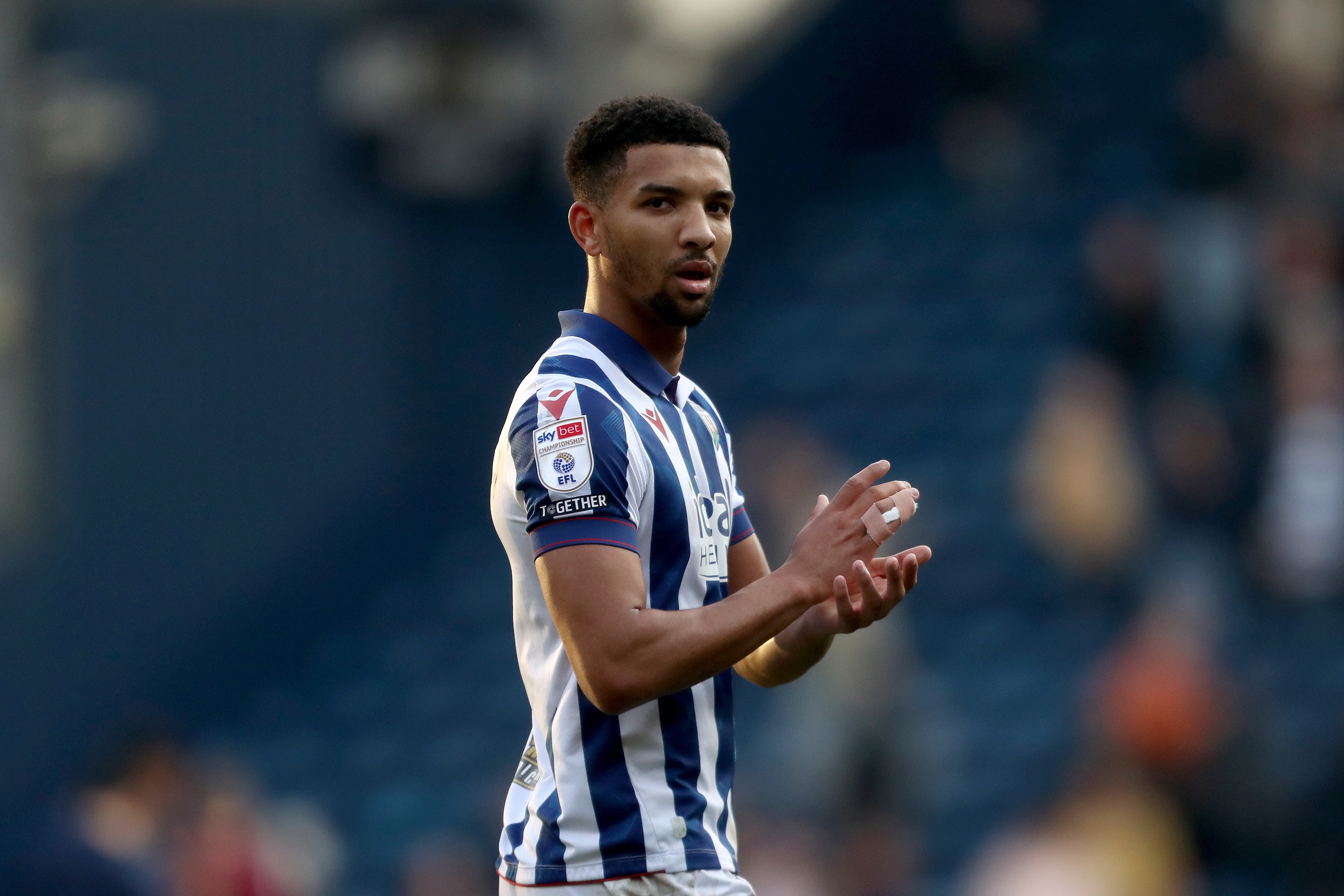 Mason Holgate applauds Albion fans after the QPR game