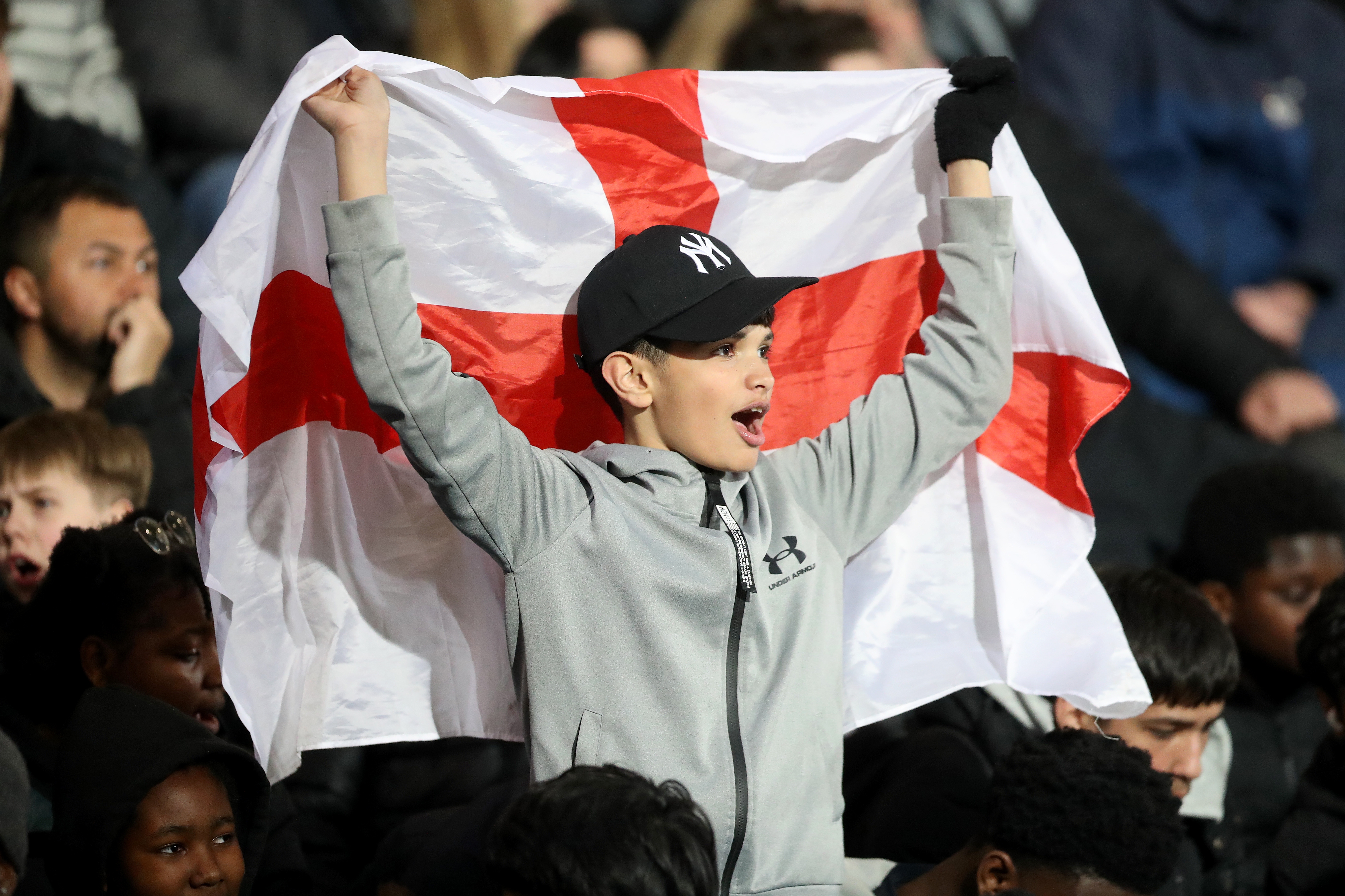 England fan in the stands at The Hawthorns with England flag