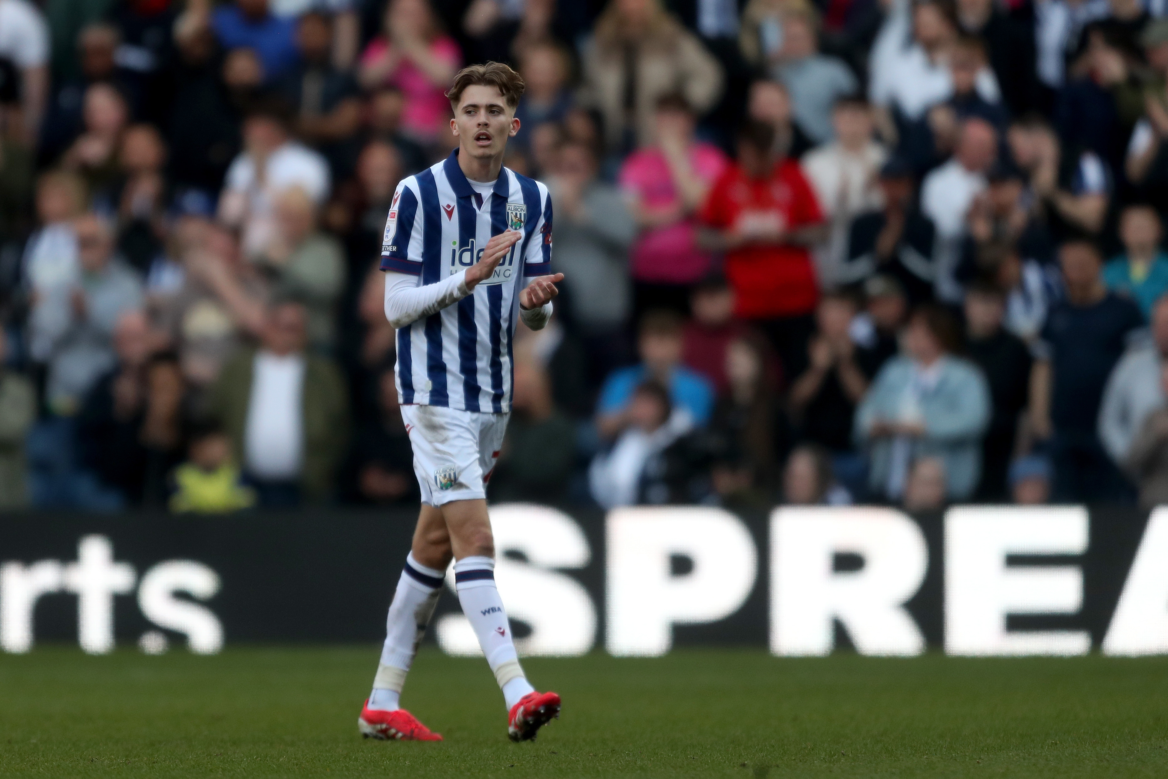 Isaac Price applauds Albion fans after winning against QPR 