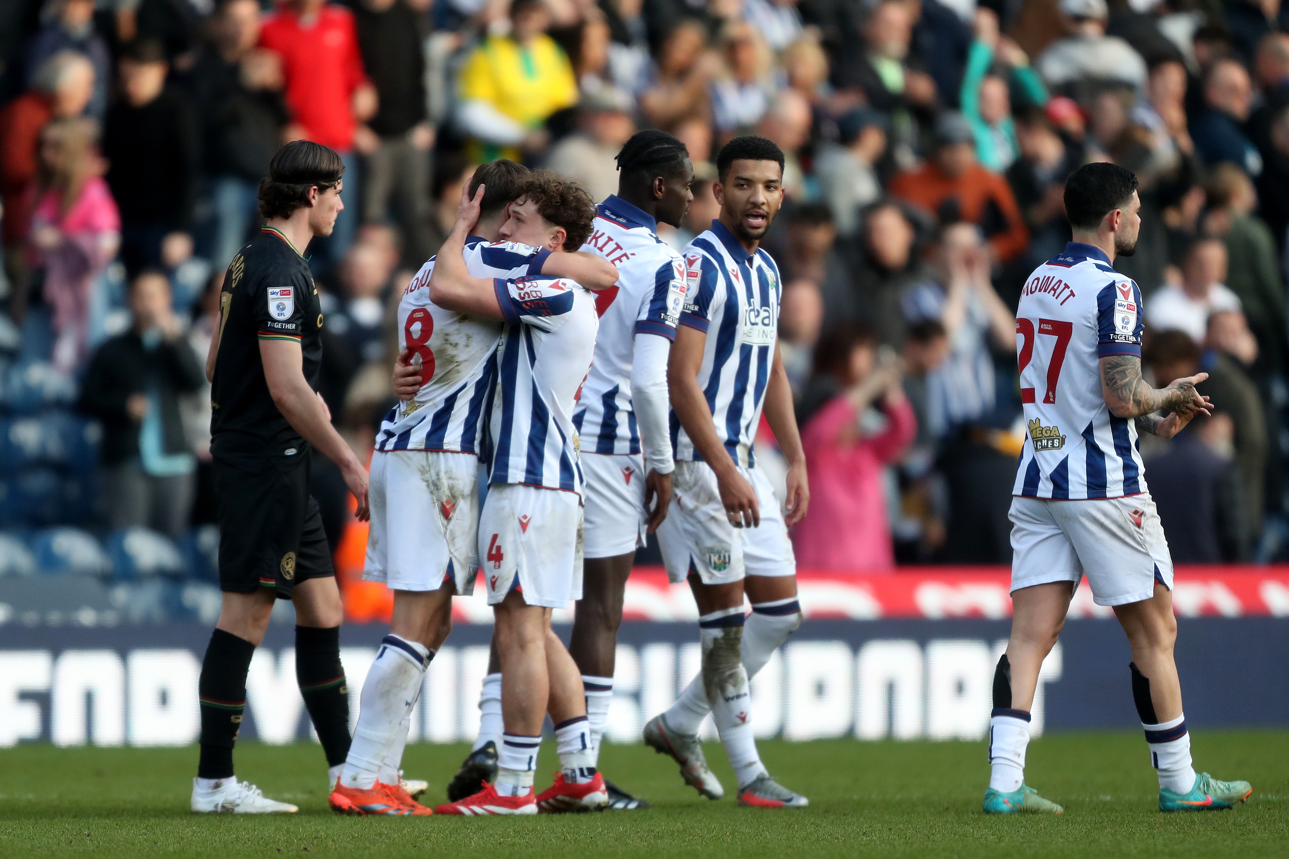 Several Albion players celebrate at full time after beating QPR 