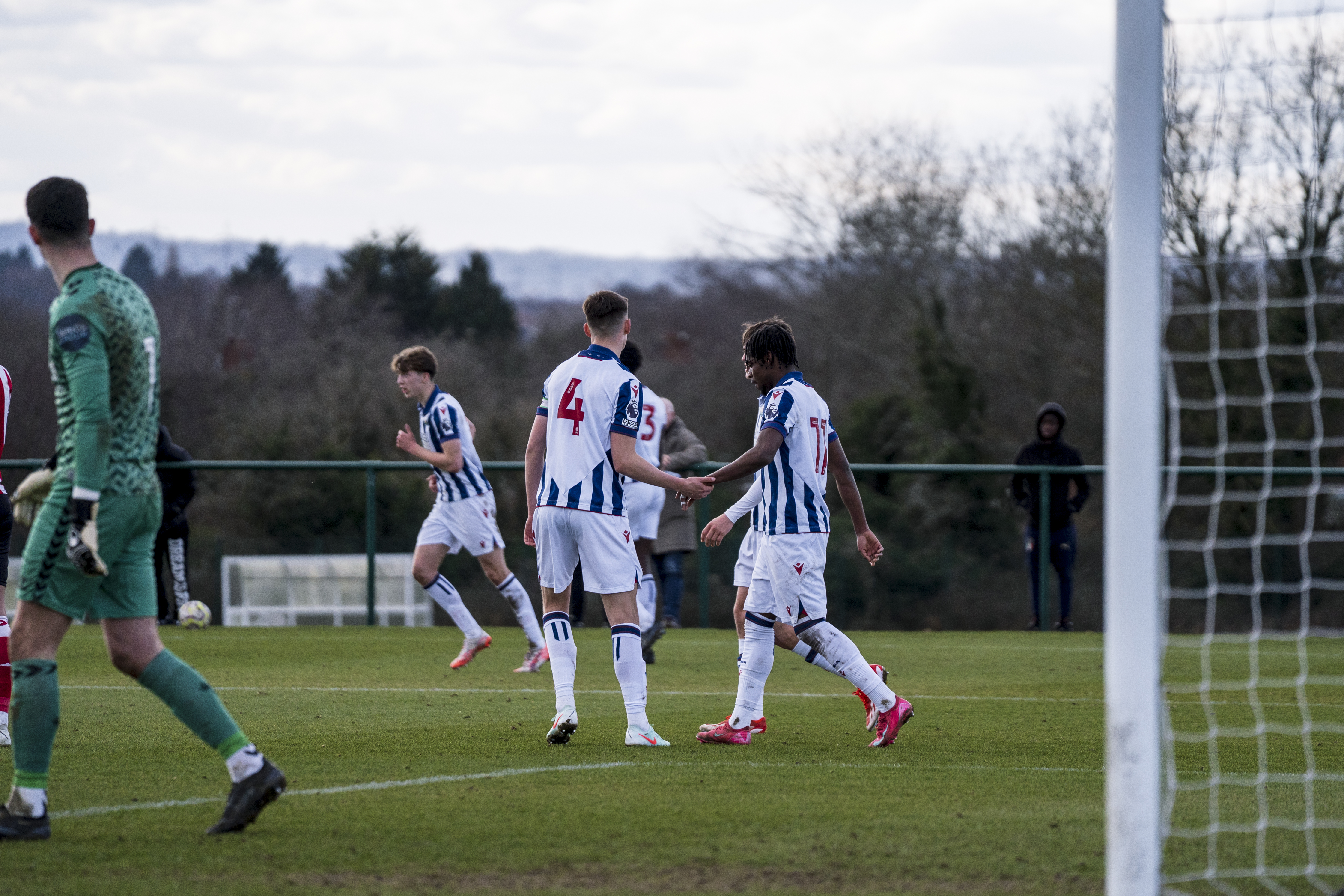 Akeel Higgins celebrates.