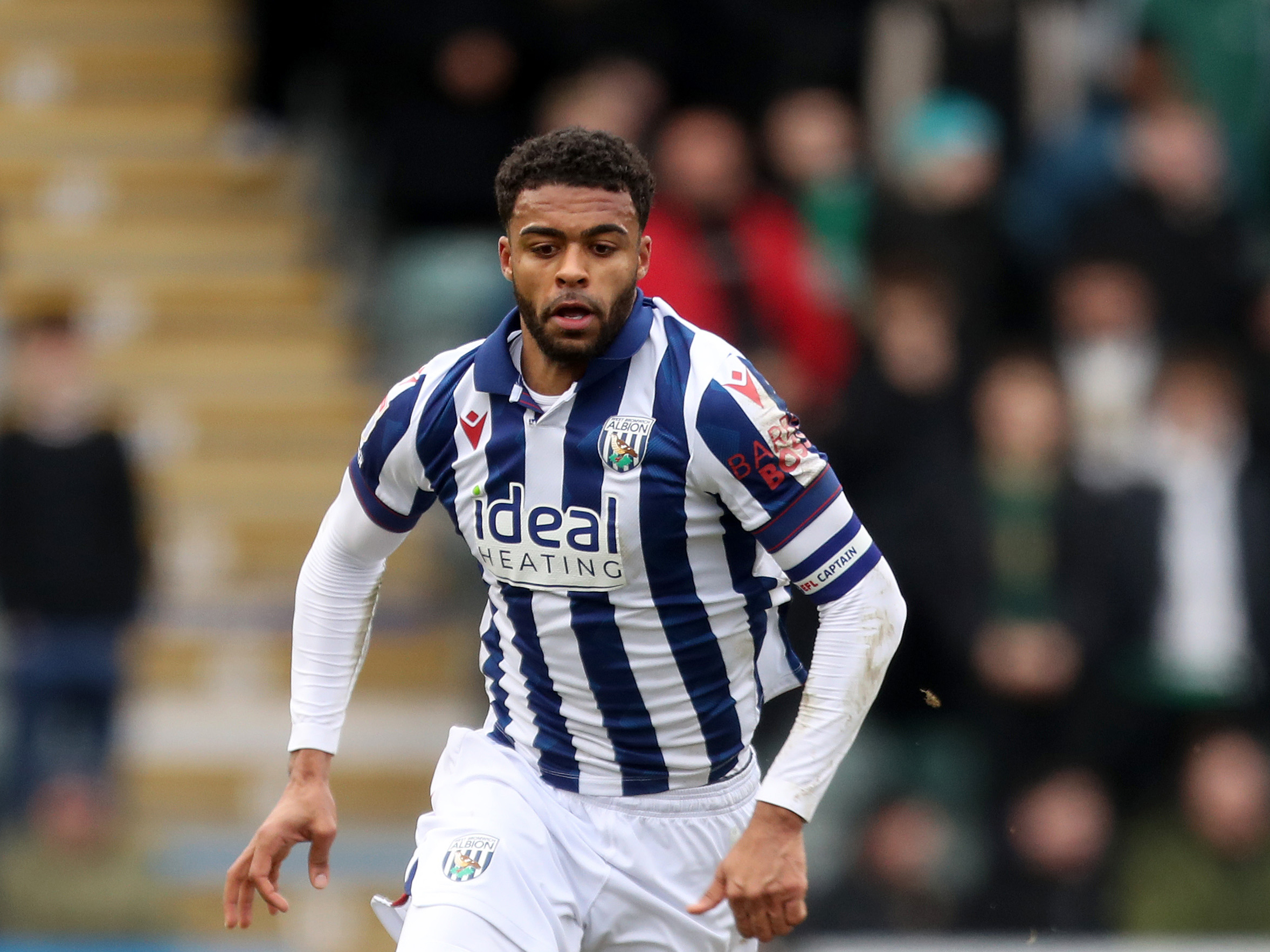 Darnell Furlong in action in the home kit for Albion