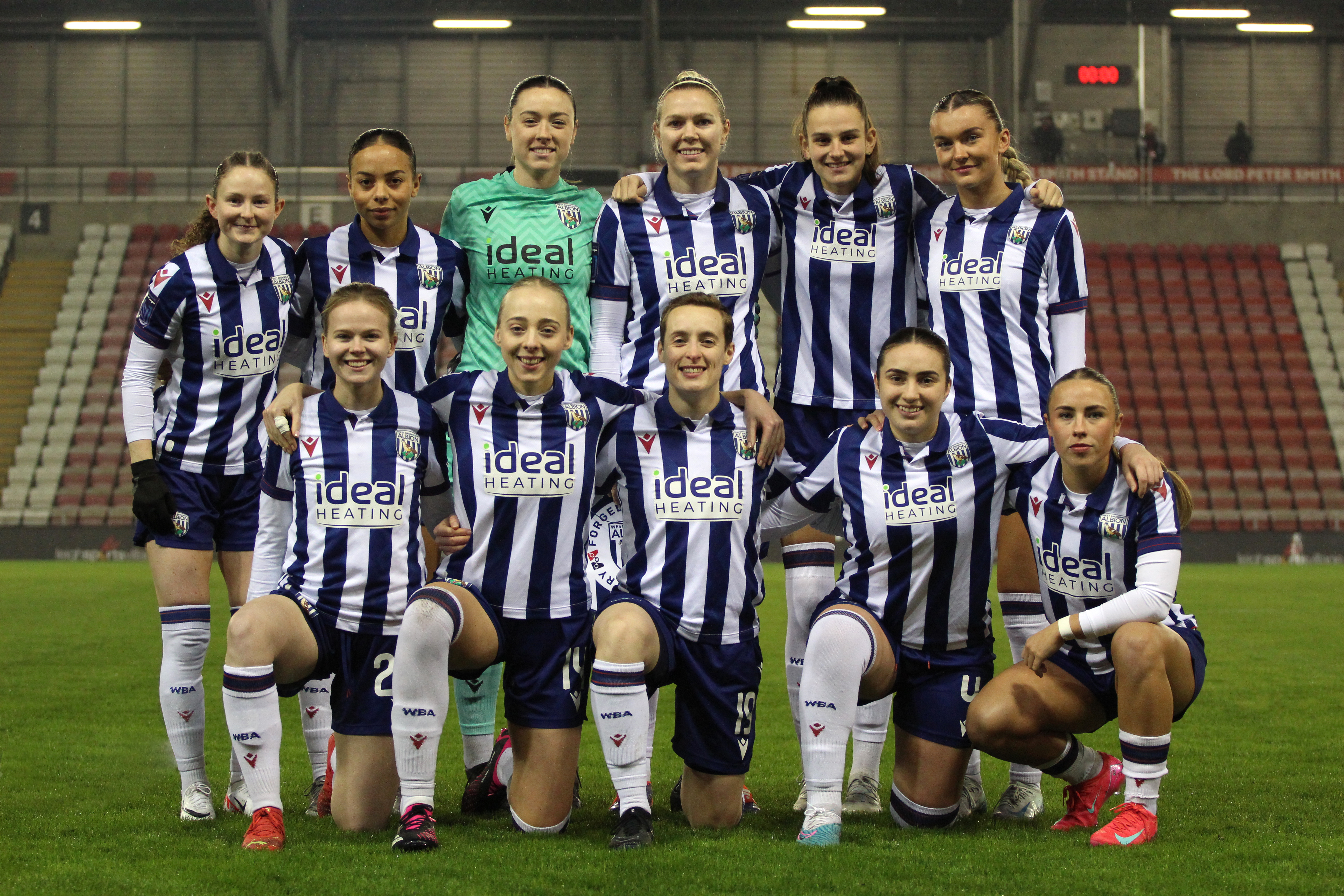 The Albion Women team photo before the Manchester United game with the players in home kit 