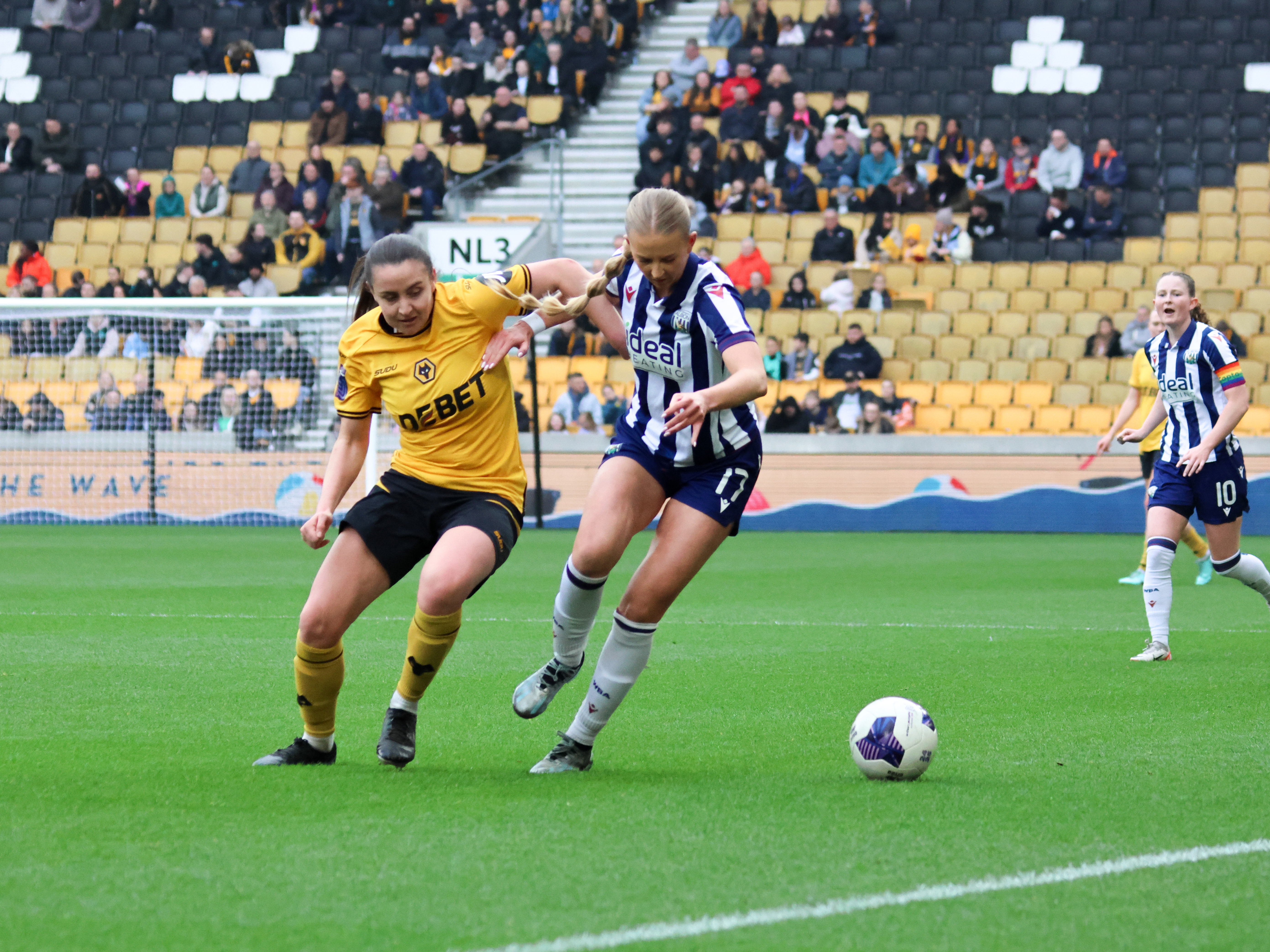 An image of Rhianne Oakley on the ball against Wolves