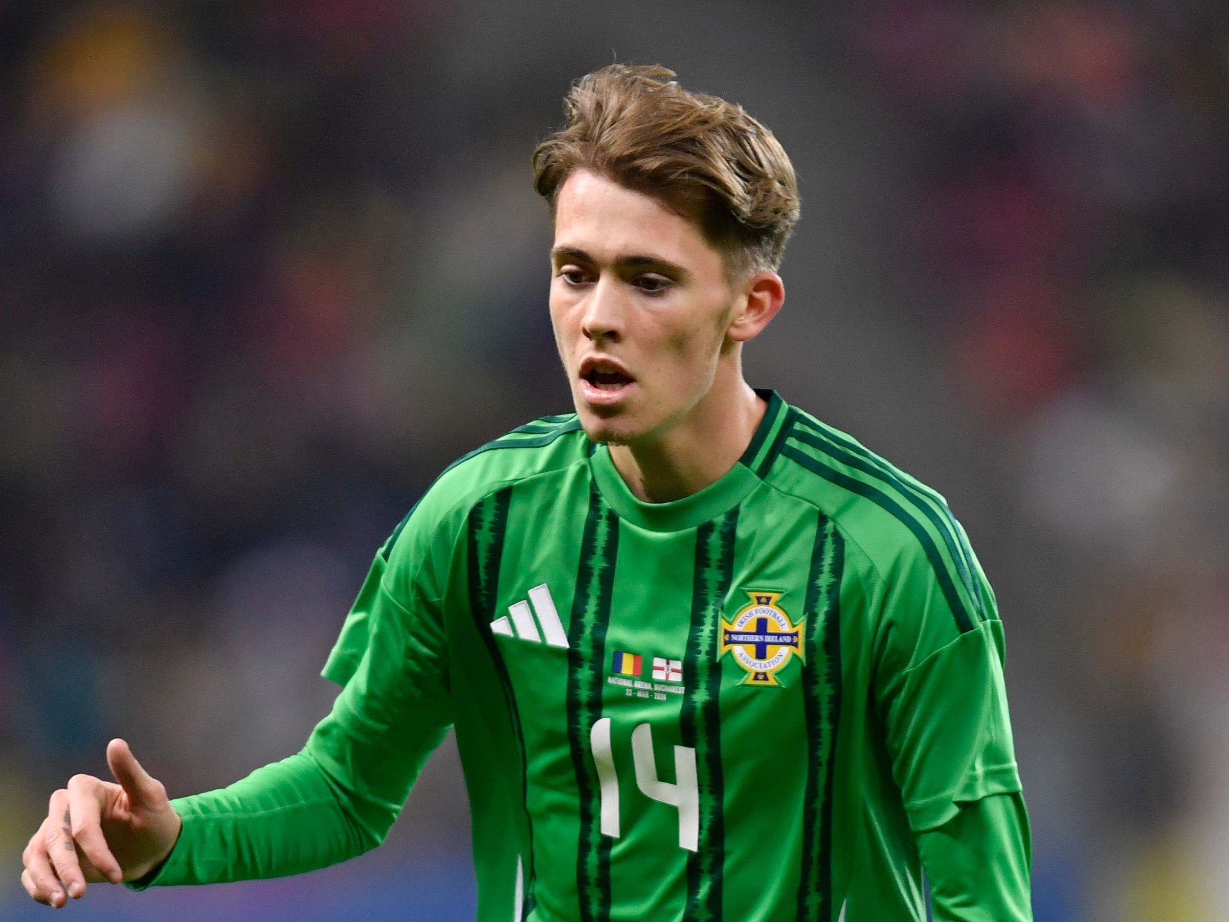 Isaac Price in action for Northern Ireland in their home kit 