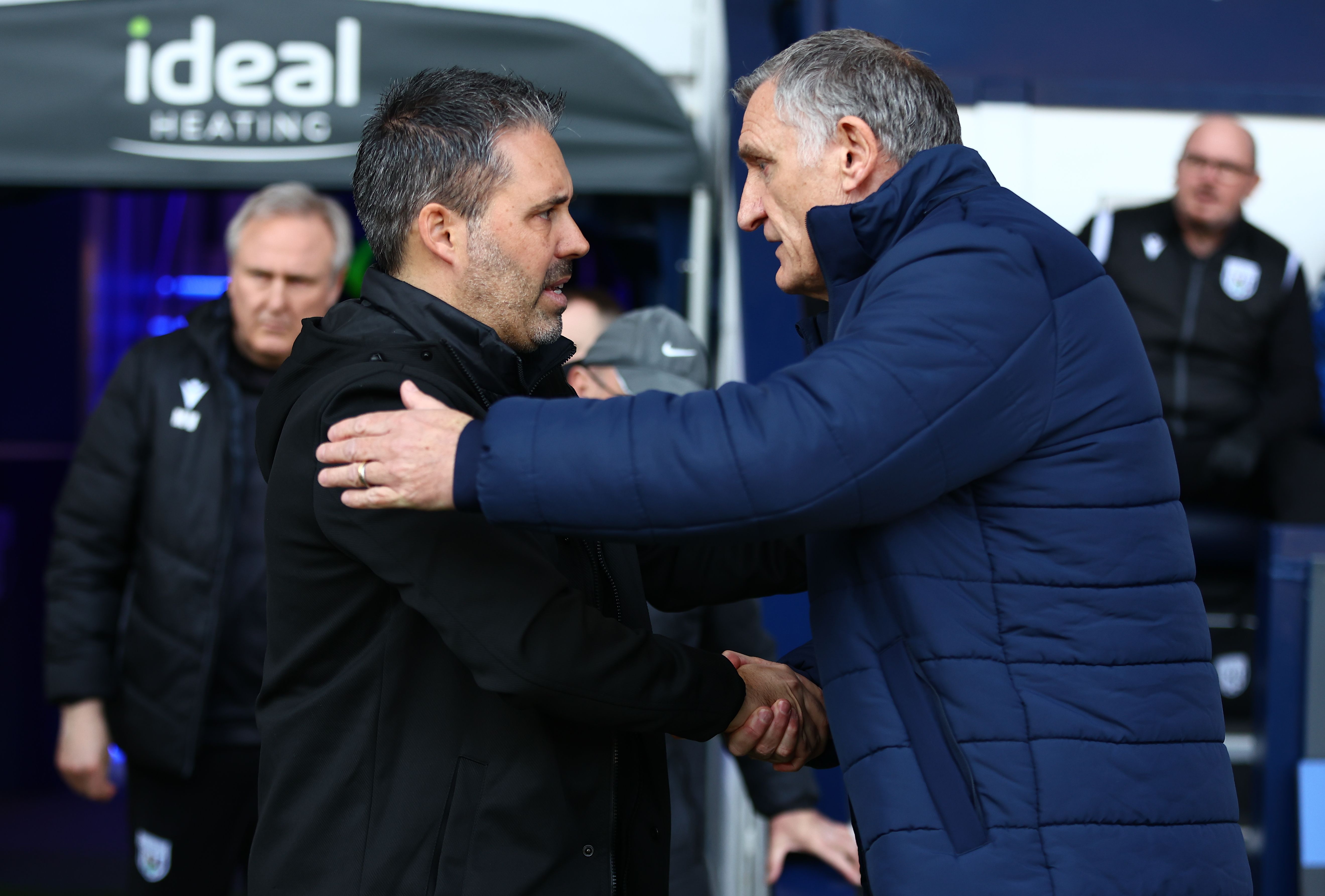 Marti Cifuentes and Tony Mowbray shake hands on the side of the pitch at The Hawthorns 