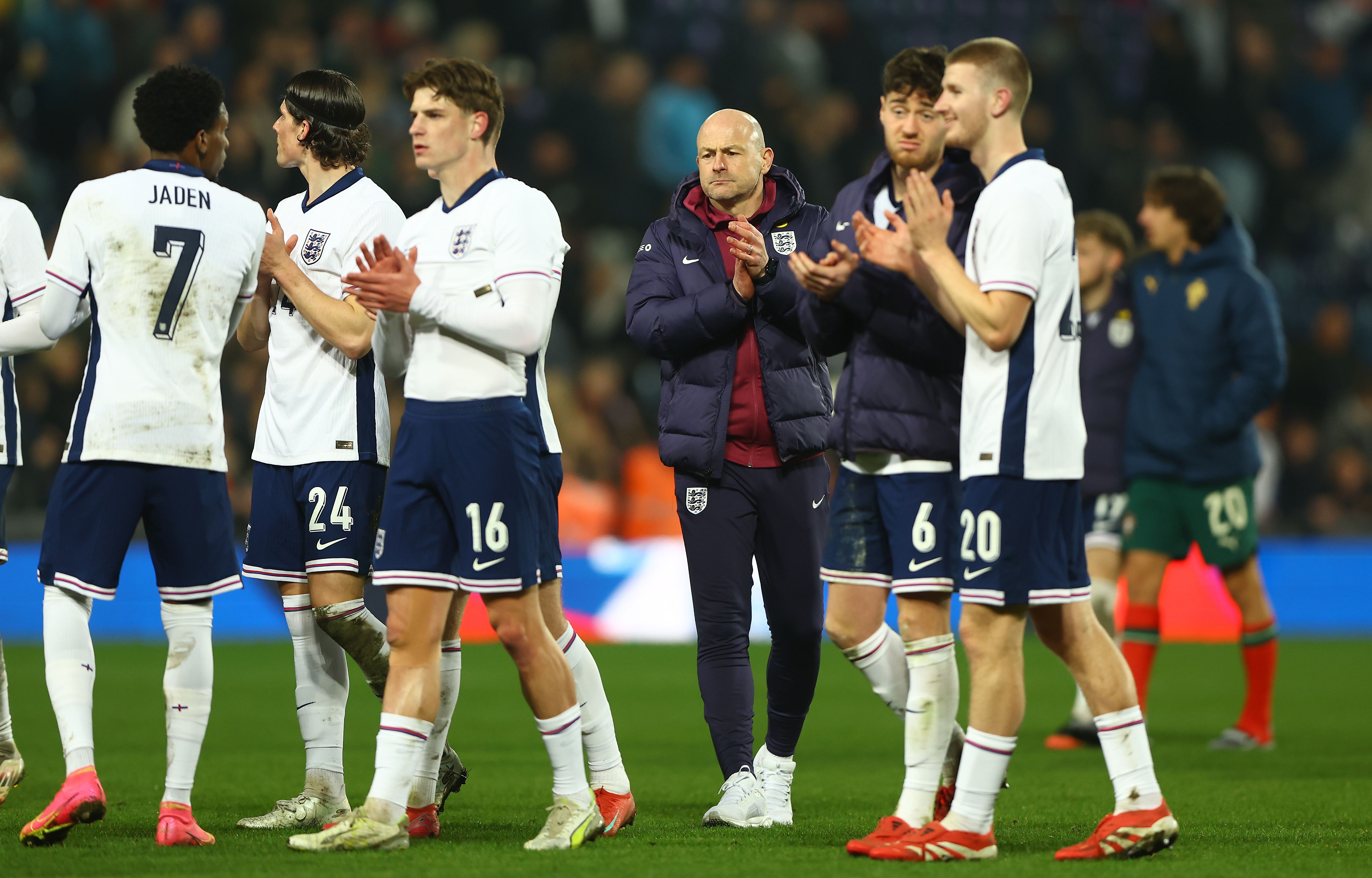 England U21 players and boss Lee Carsley applaud England fans after beating Portugal at The Hawthorns