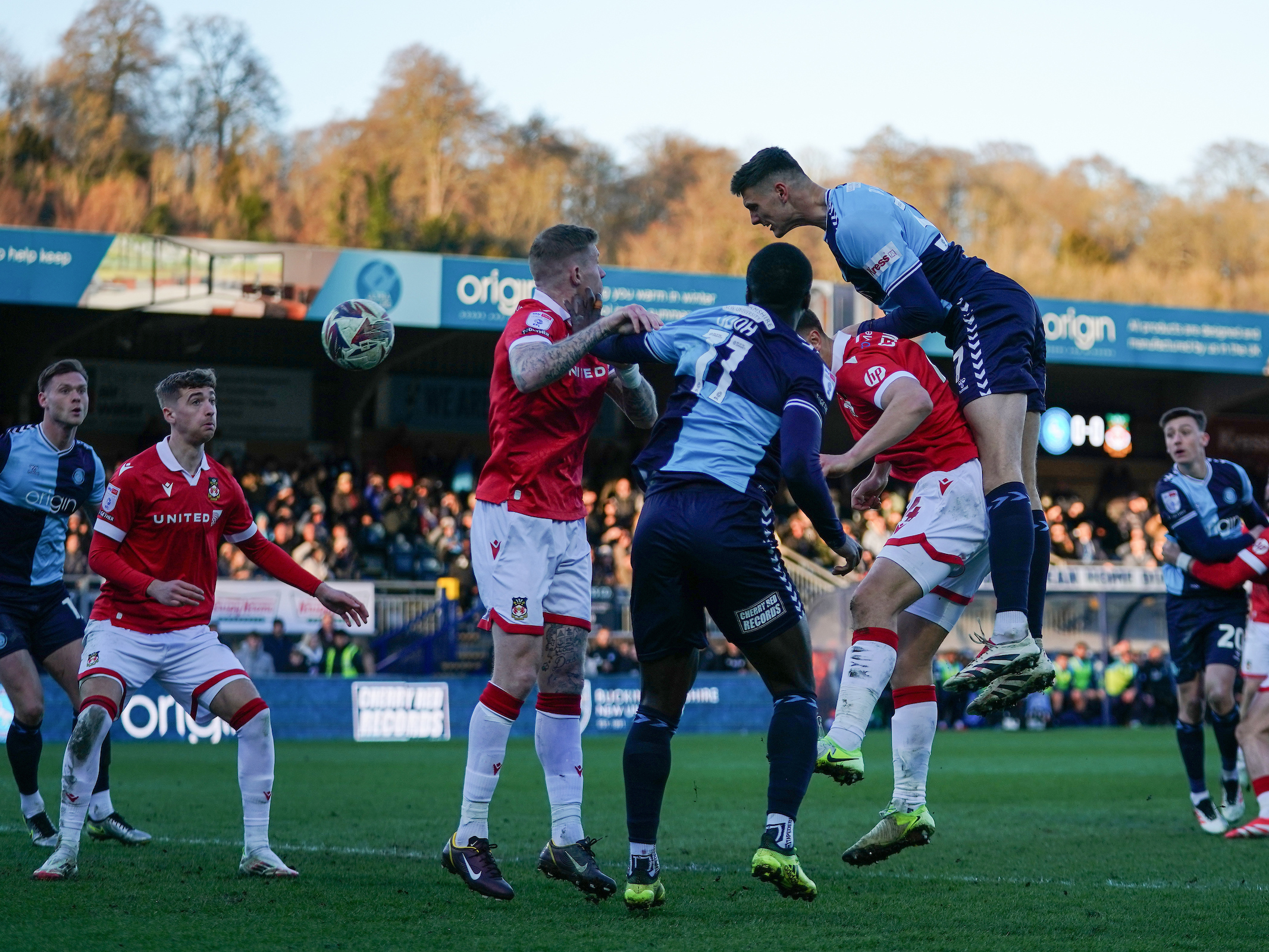 A photo of Caleb Taylor in action for loan club Wycombe, wearing their light blue and navy home kit