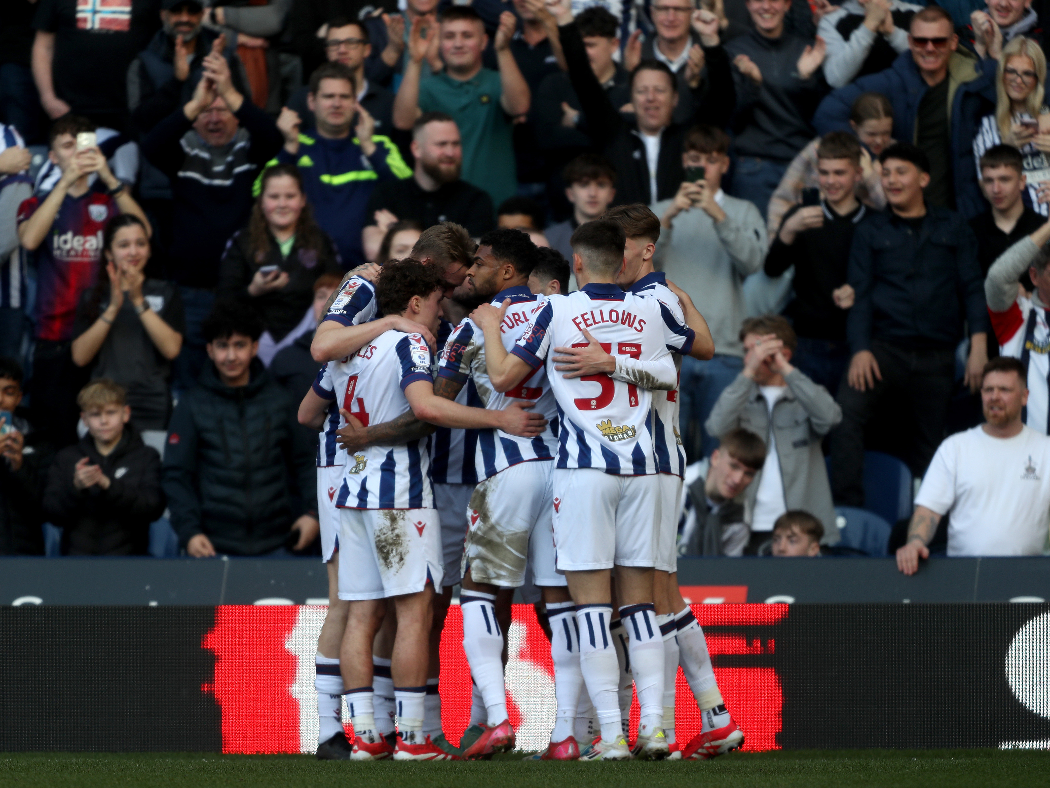 An image of the Albion team celebrating Armstrong's goal against QPR