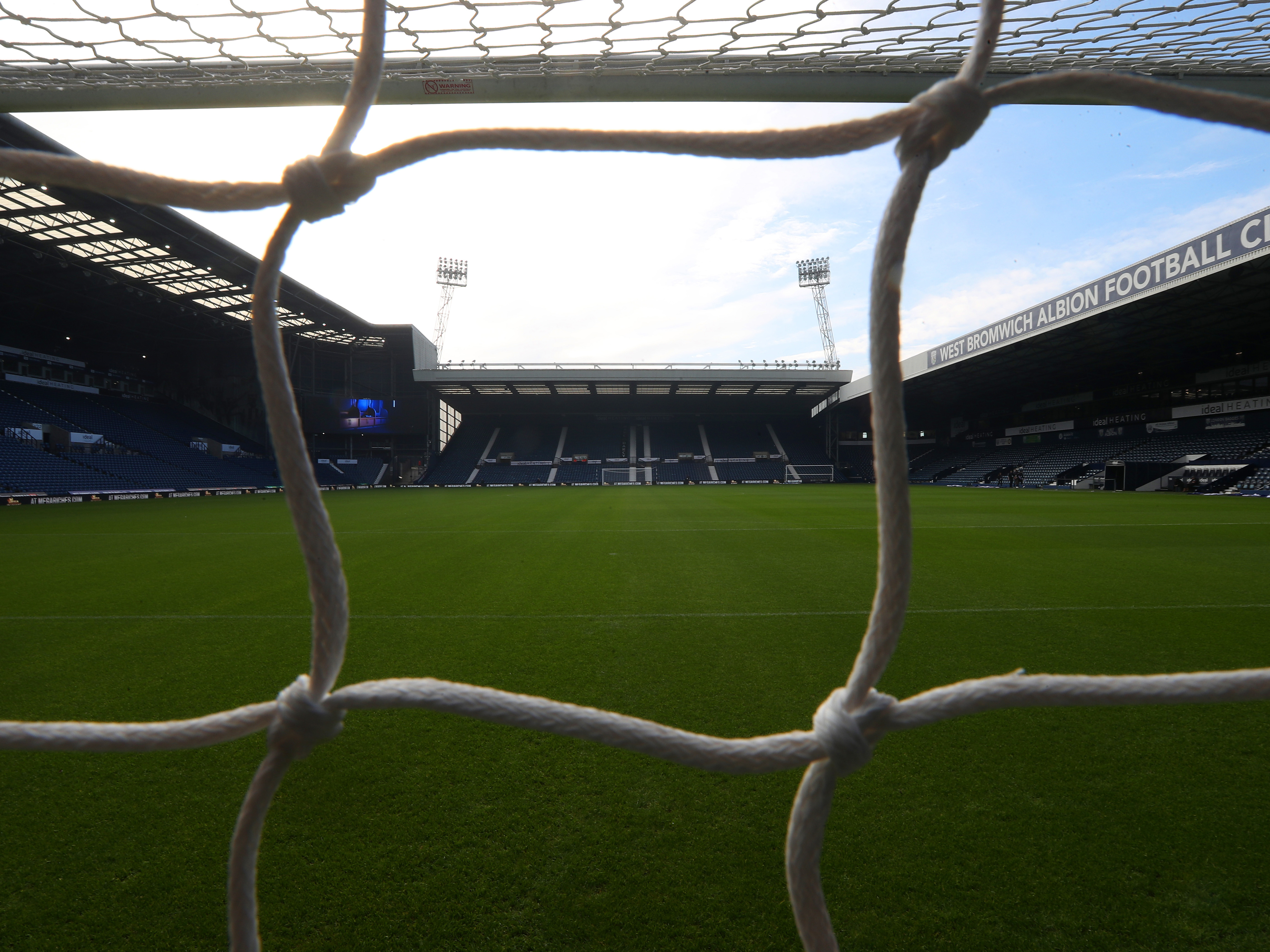 An image of The Hawthorns from the Birmingham Road End, looking through the net