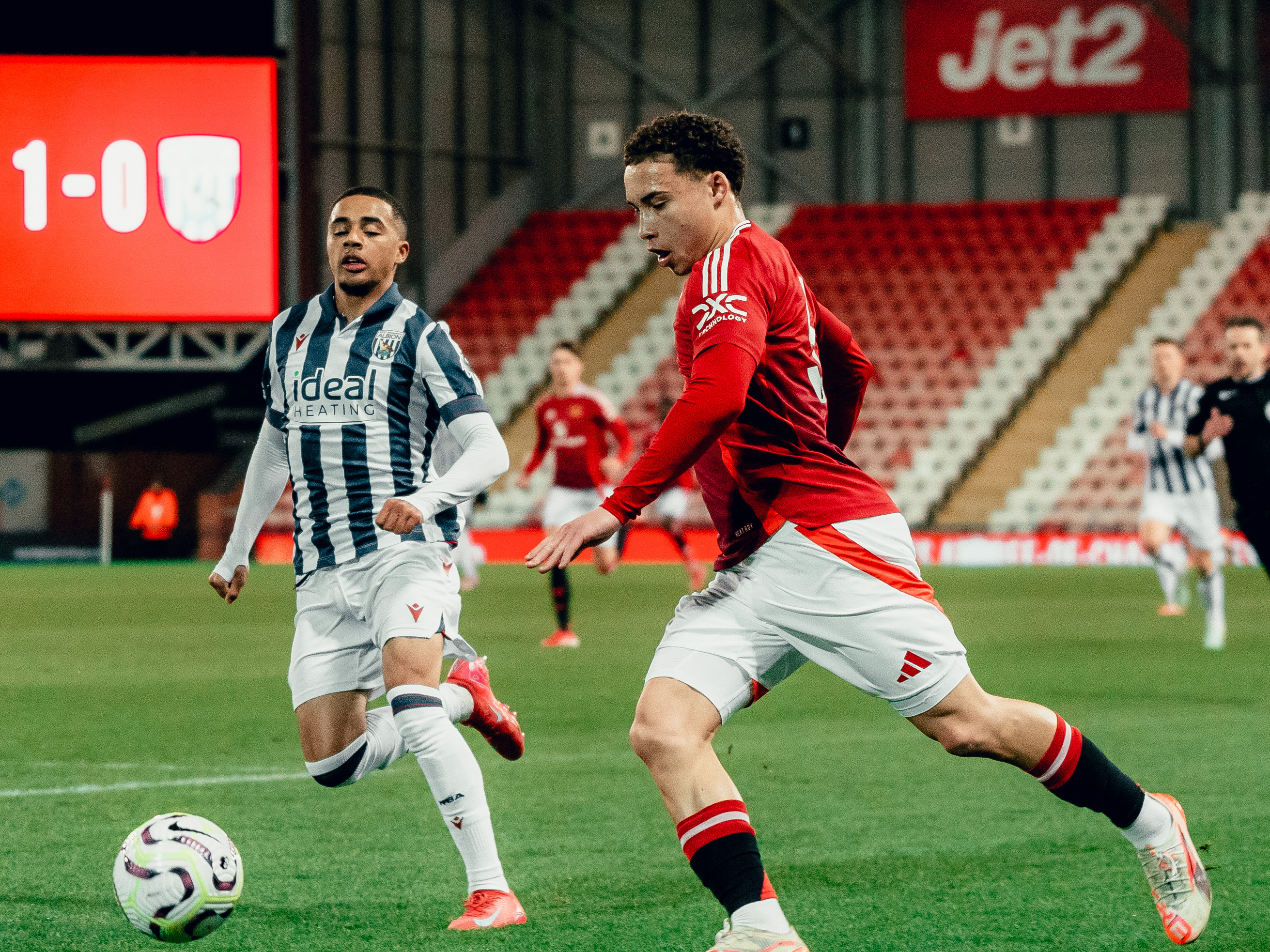 Deago Nelson in action for Albion's PL2 team at Man U in the home kit 