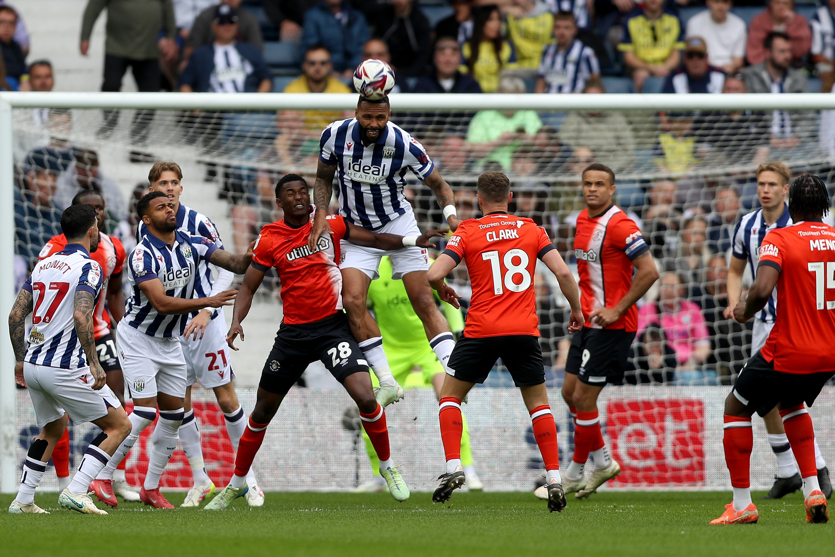 Kyle Bartley heads the ball clear against Luton Town