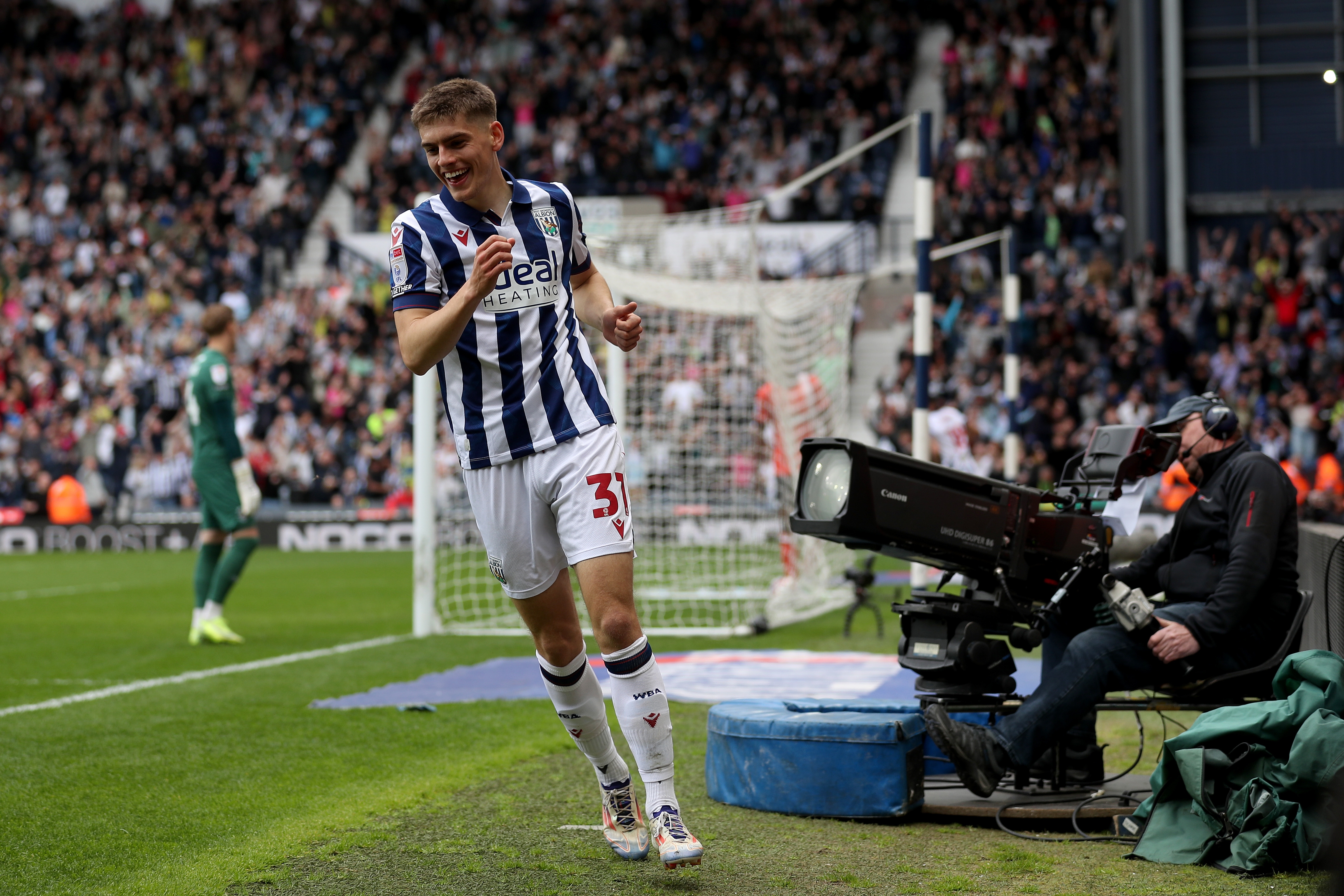 Tom Fellows celebrates alone after scoring against Luton Town