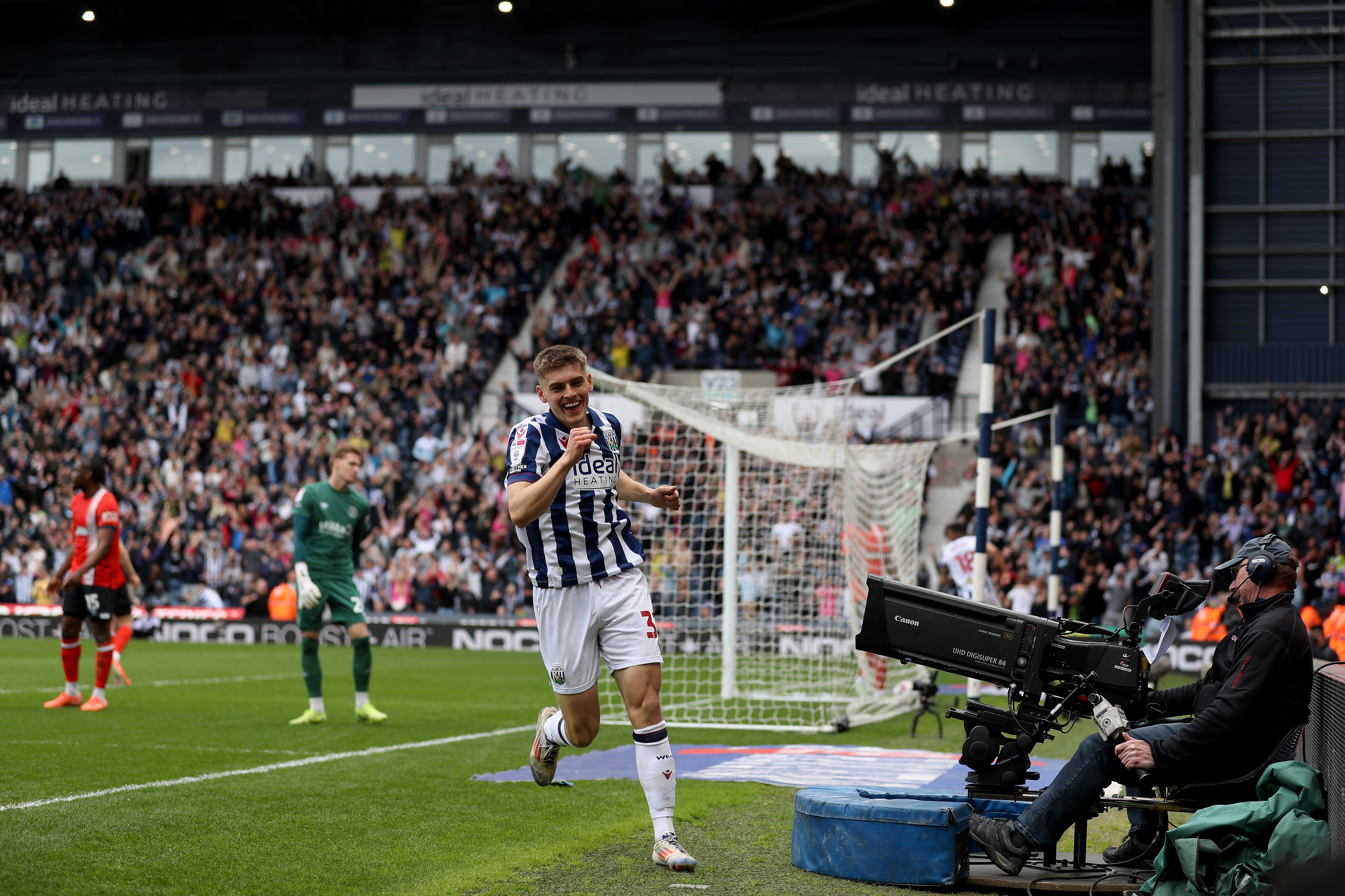Tom Fellows celebrates alone after scoring against Luton Town