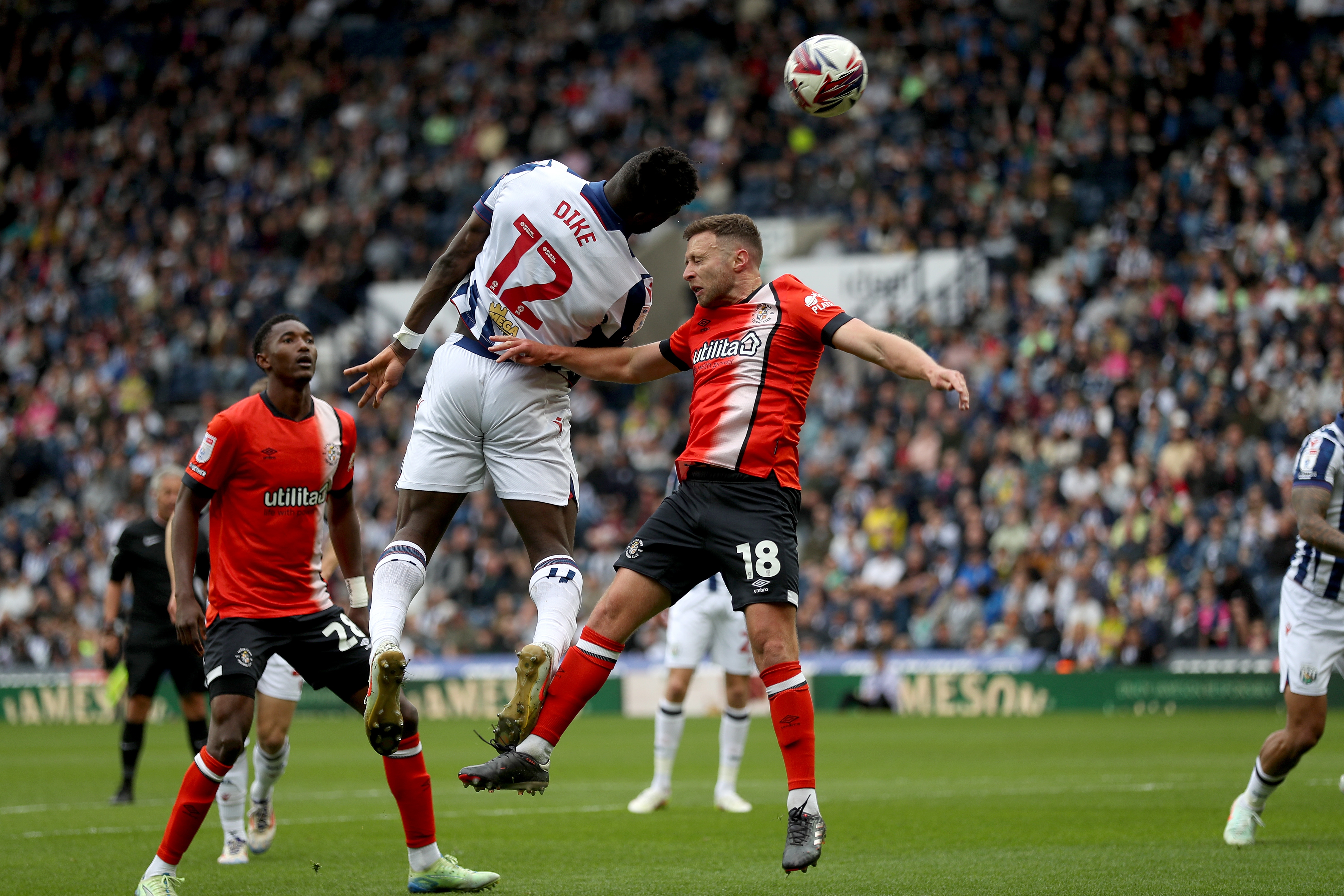 Daryl Dike scoring a header against Luton Town