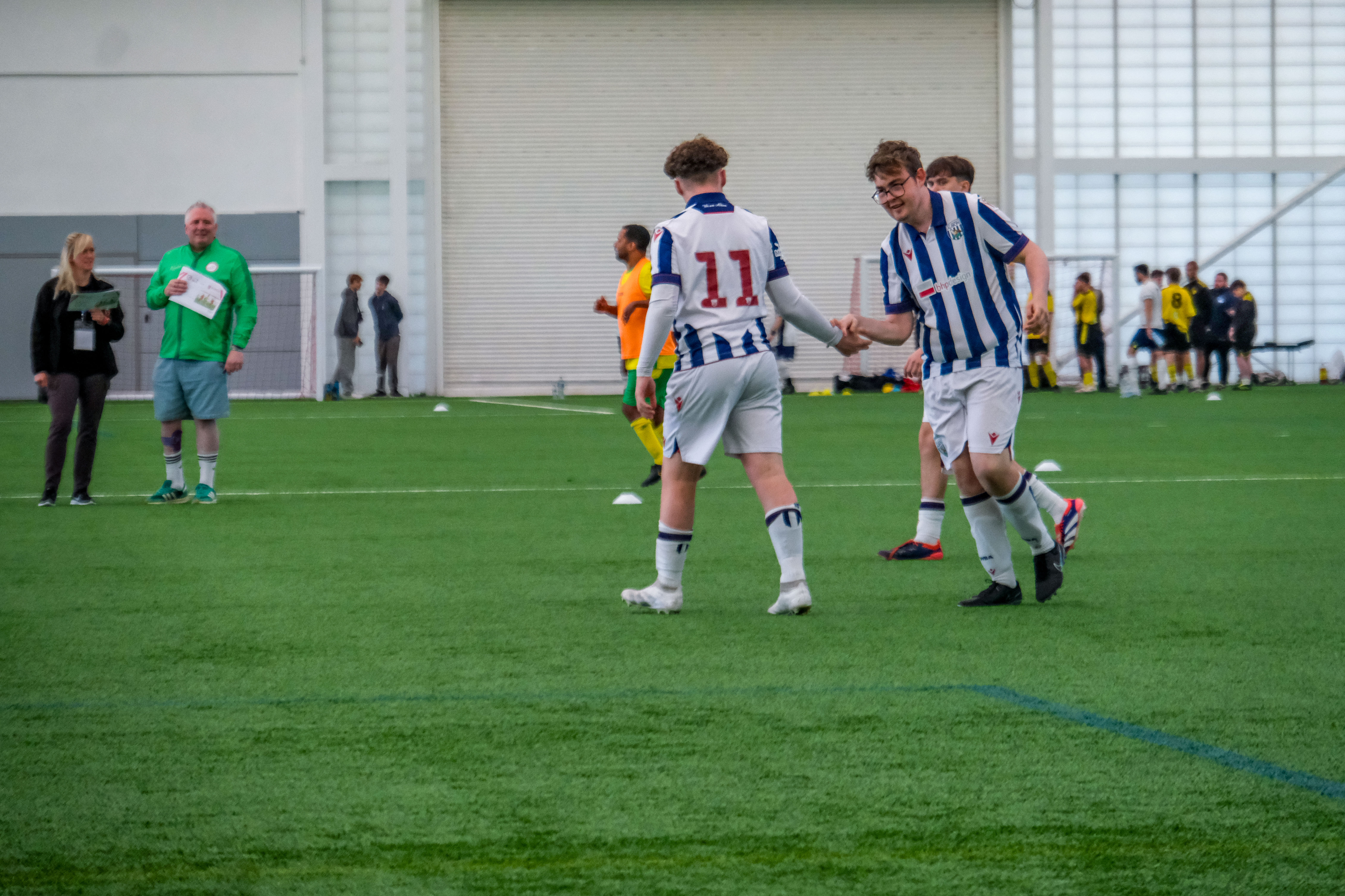 Calum and Ollie embrace after scoring.