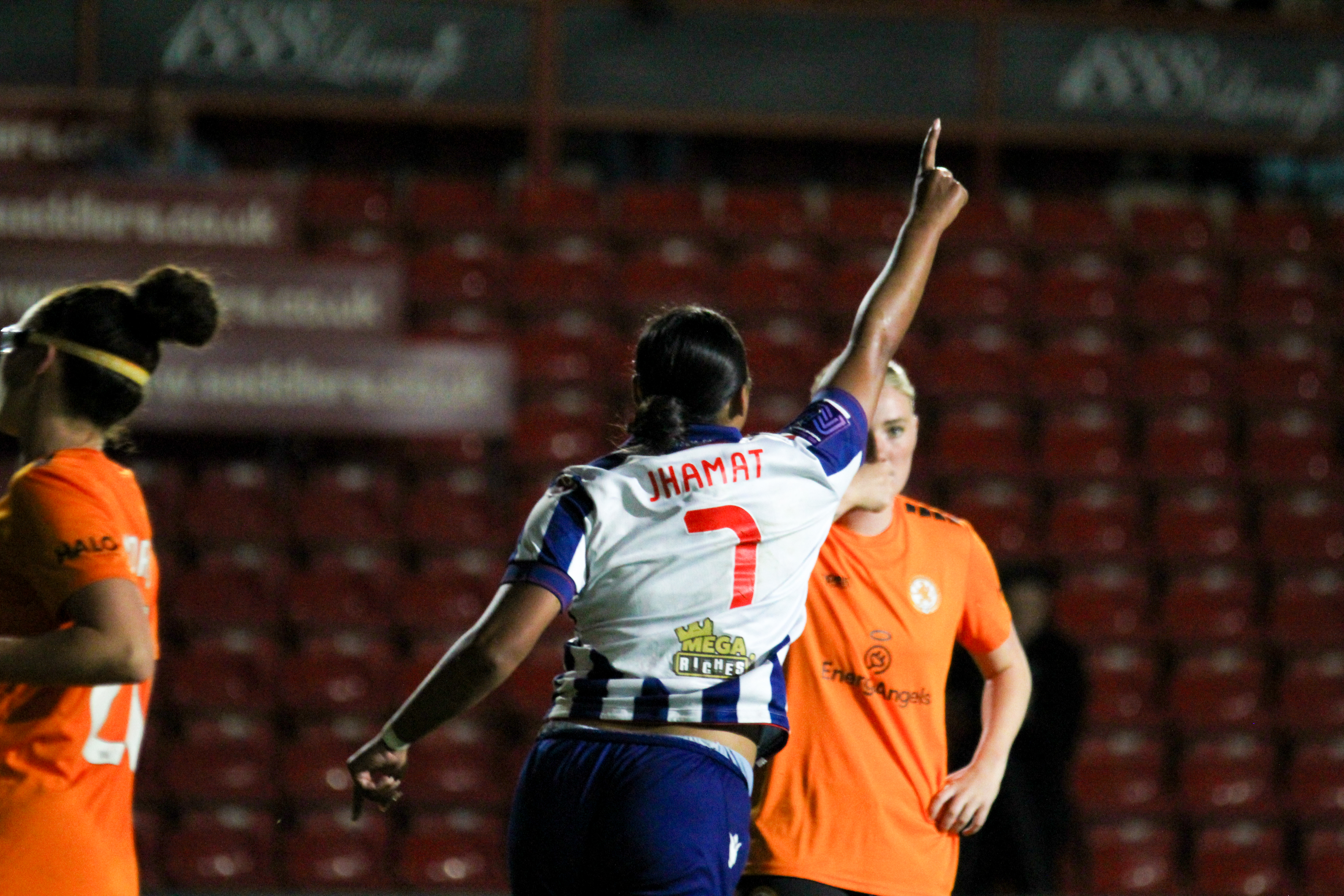 Simran Jhamat celebrates scoring against Rugby in the final at Walsall in the home kit