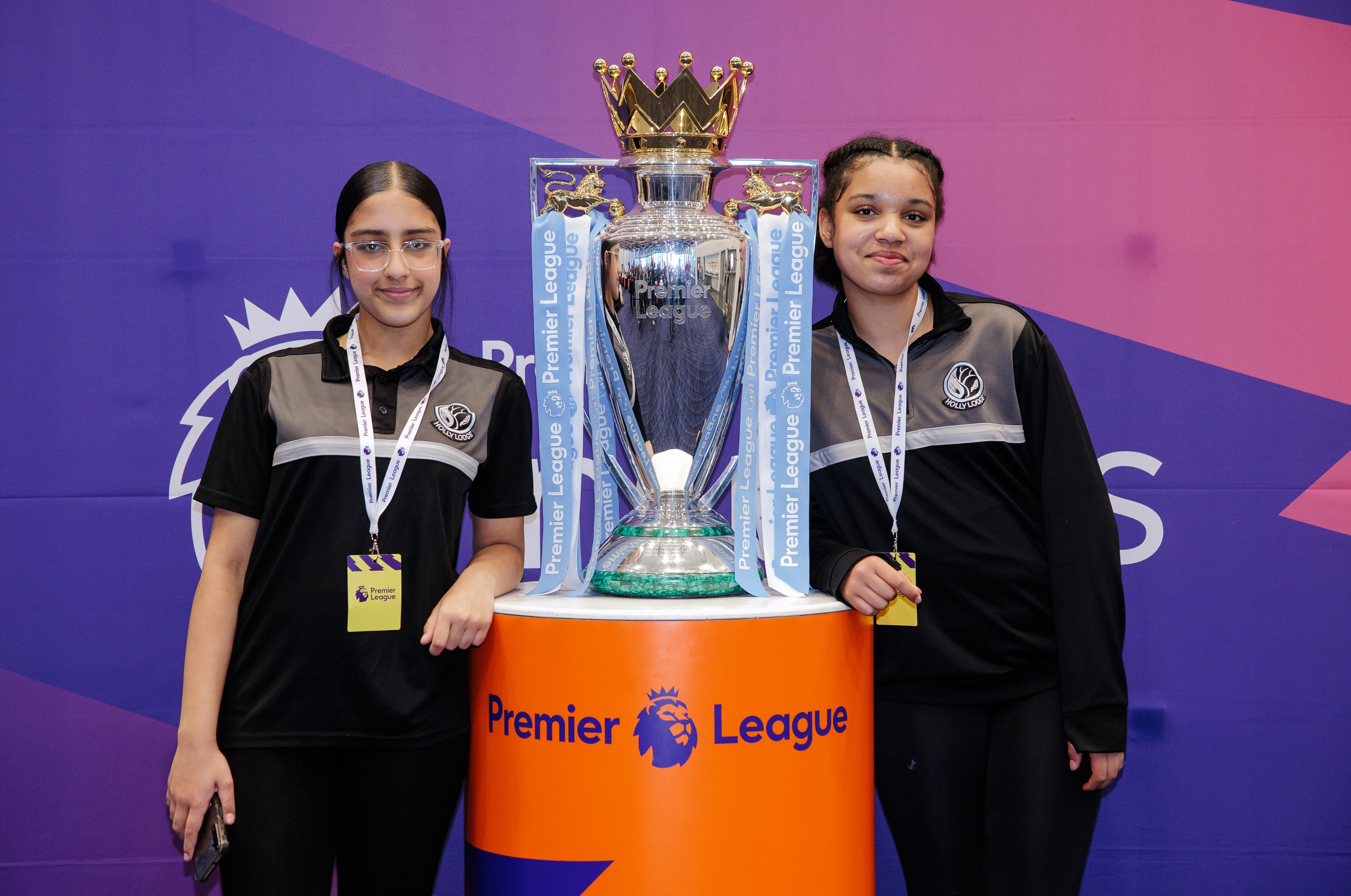 Holly Lodge students standing next to the Premier League trophy