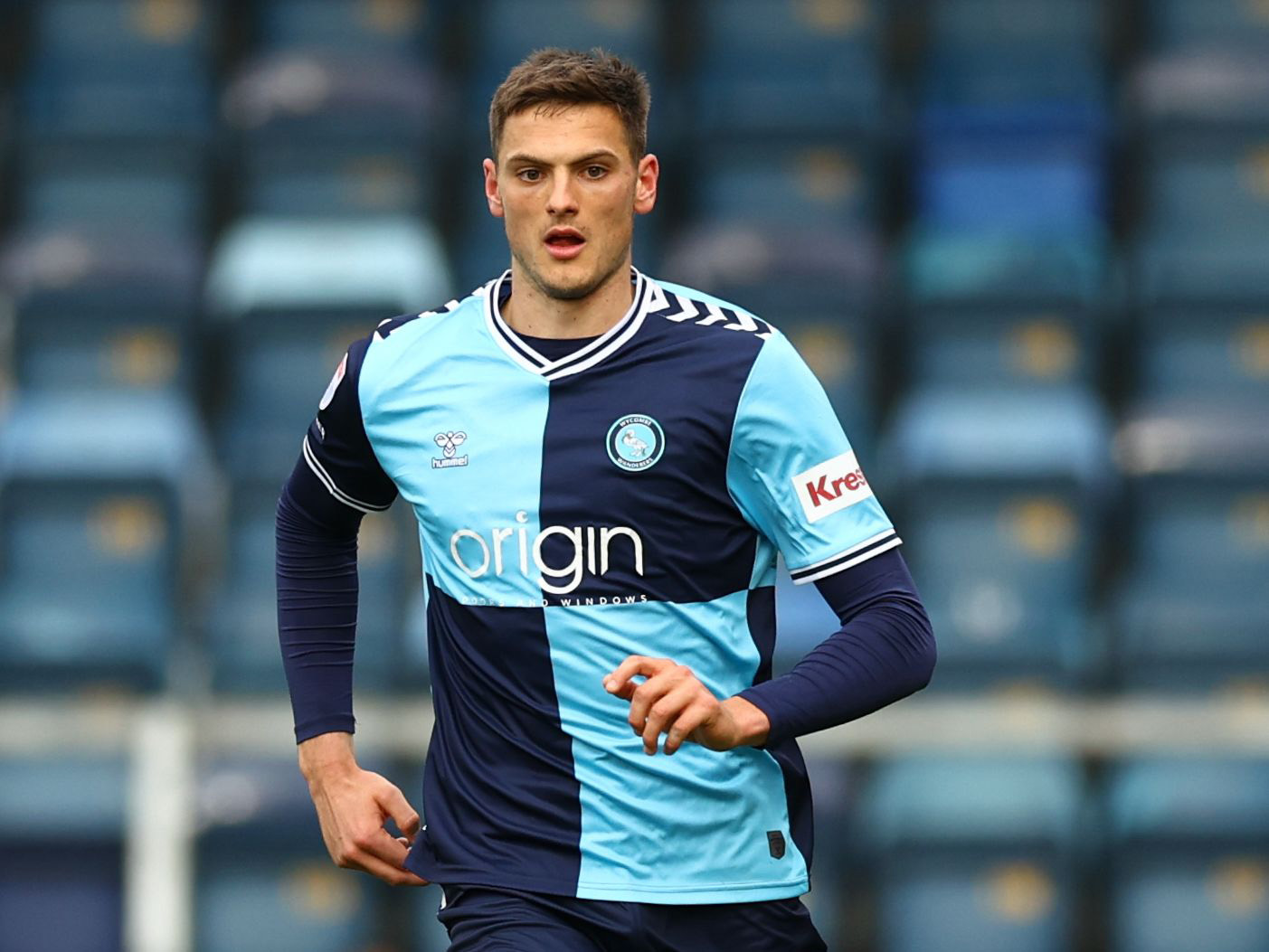 Caleb Taylor in action for Wycombe Wanderers in their home kit