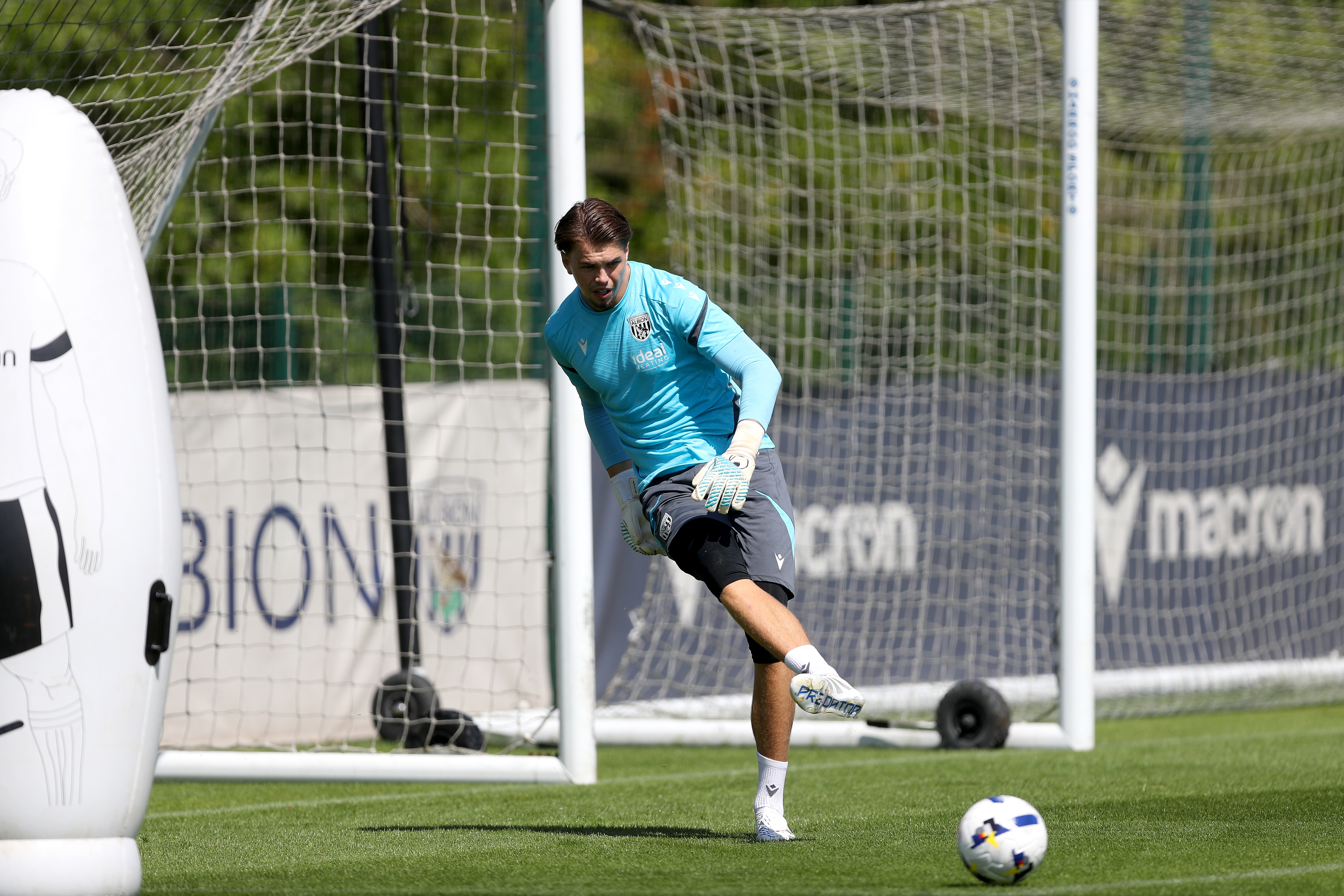 Josh Griffiths passing a ball during a training session