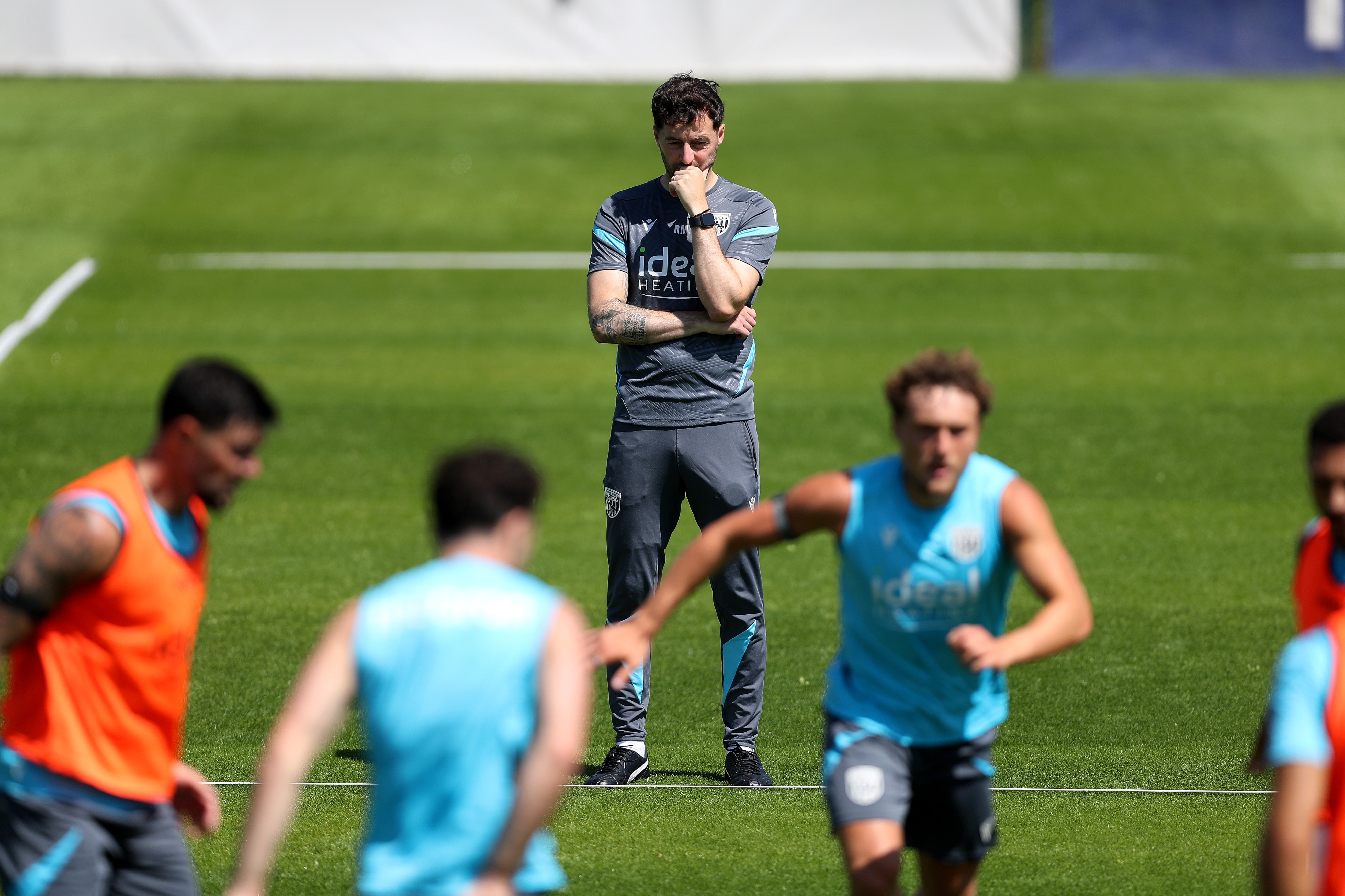 Ryan Mason in the background of a training session keeping watch
