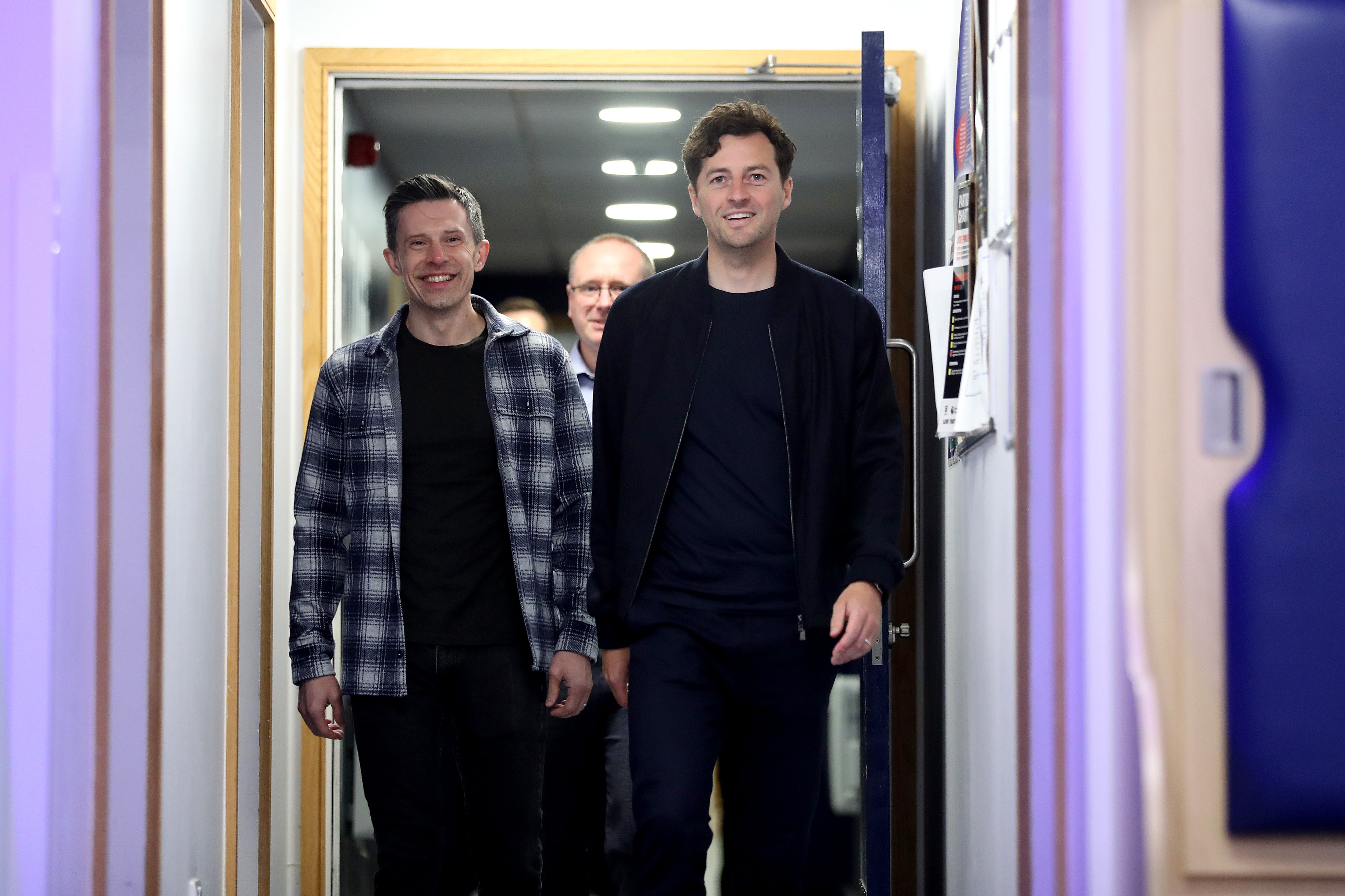 Ryan Mason and Andrew Nestor walking down a corridor at The Hawthorns