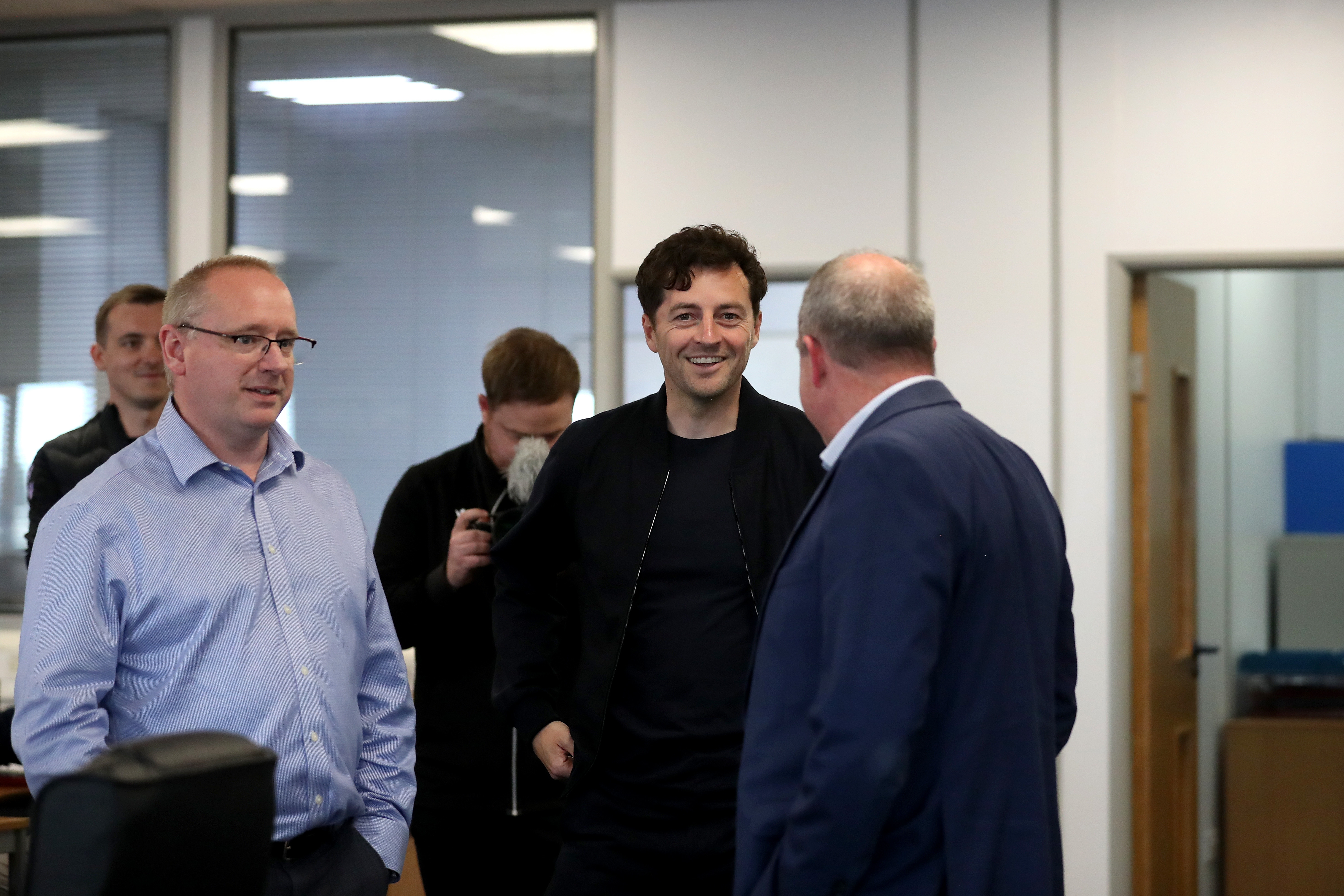 Ryan Mason chatting to staff members 