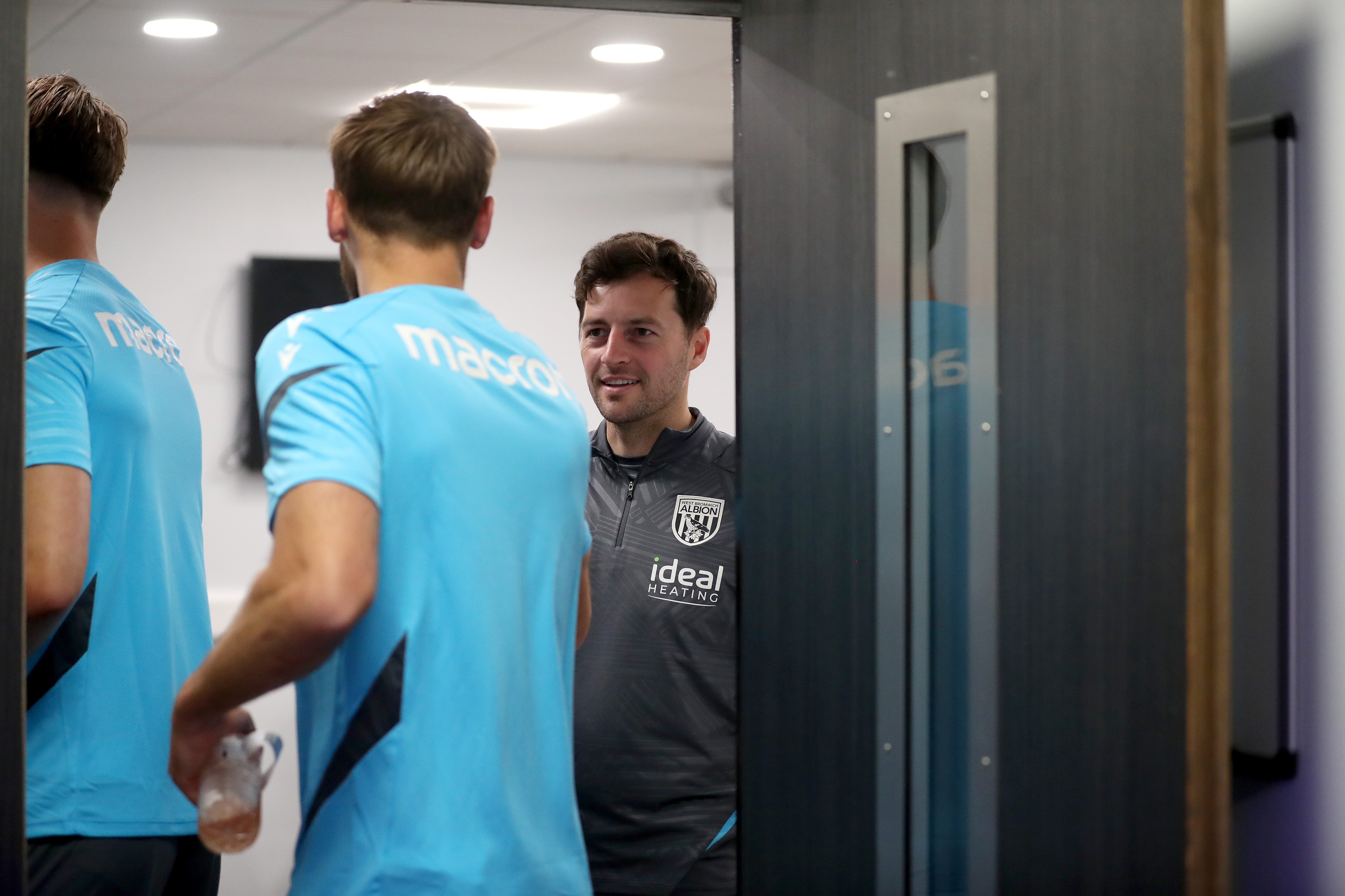 Ryan Mason greeting Albion players before a meeting