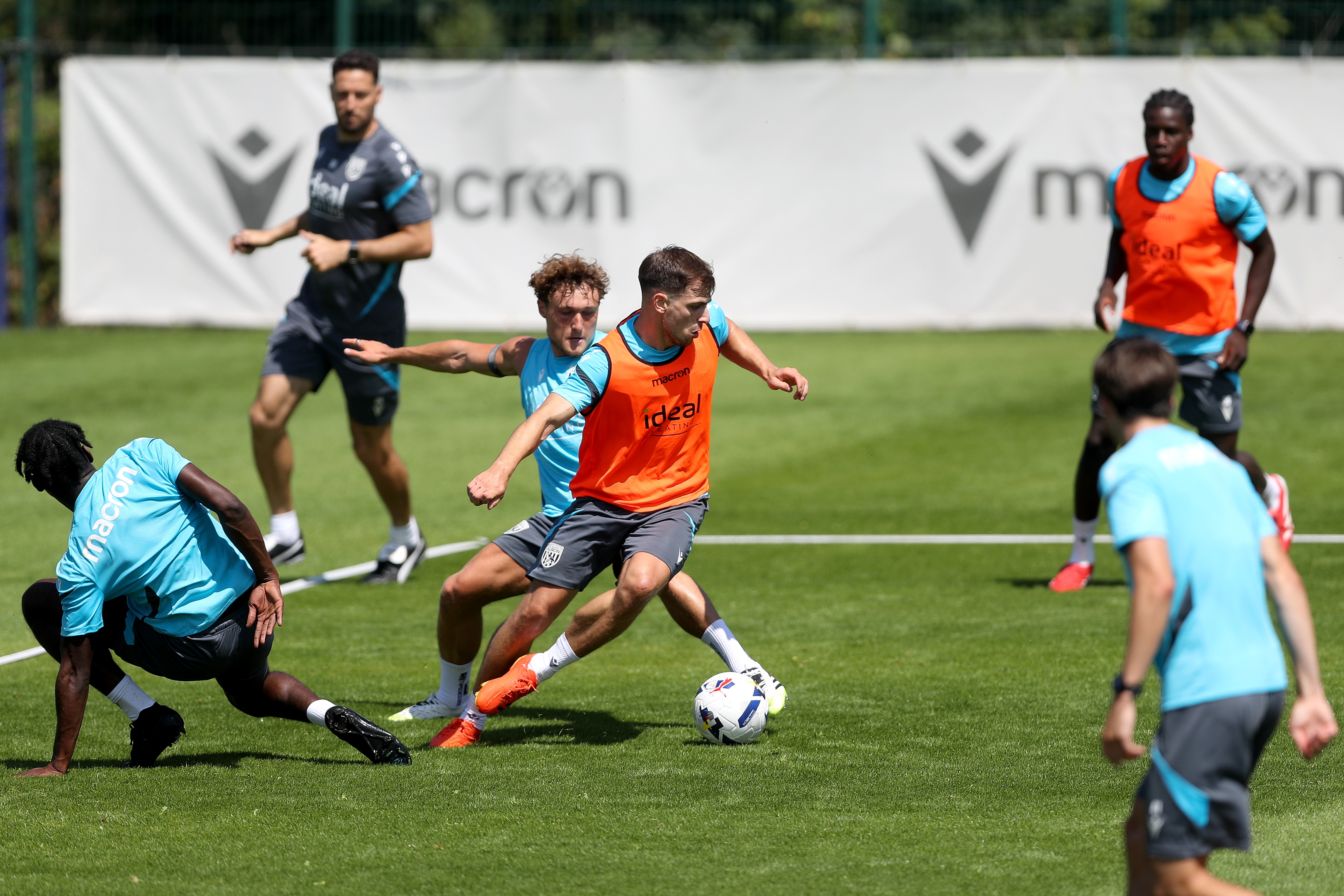 Jayson Molumby on the ball during a training session with Callum Styles behind him