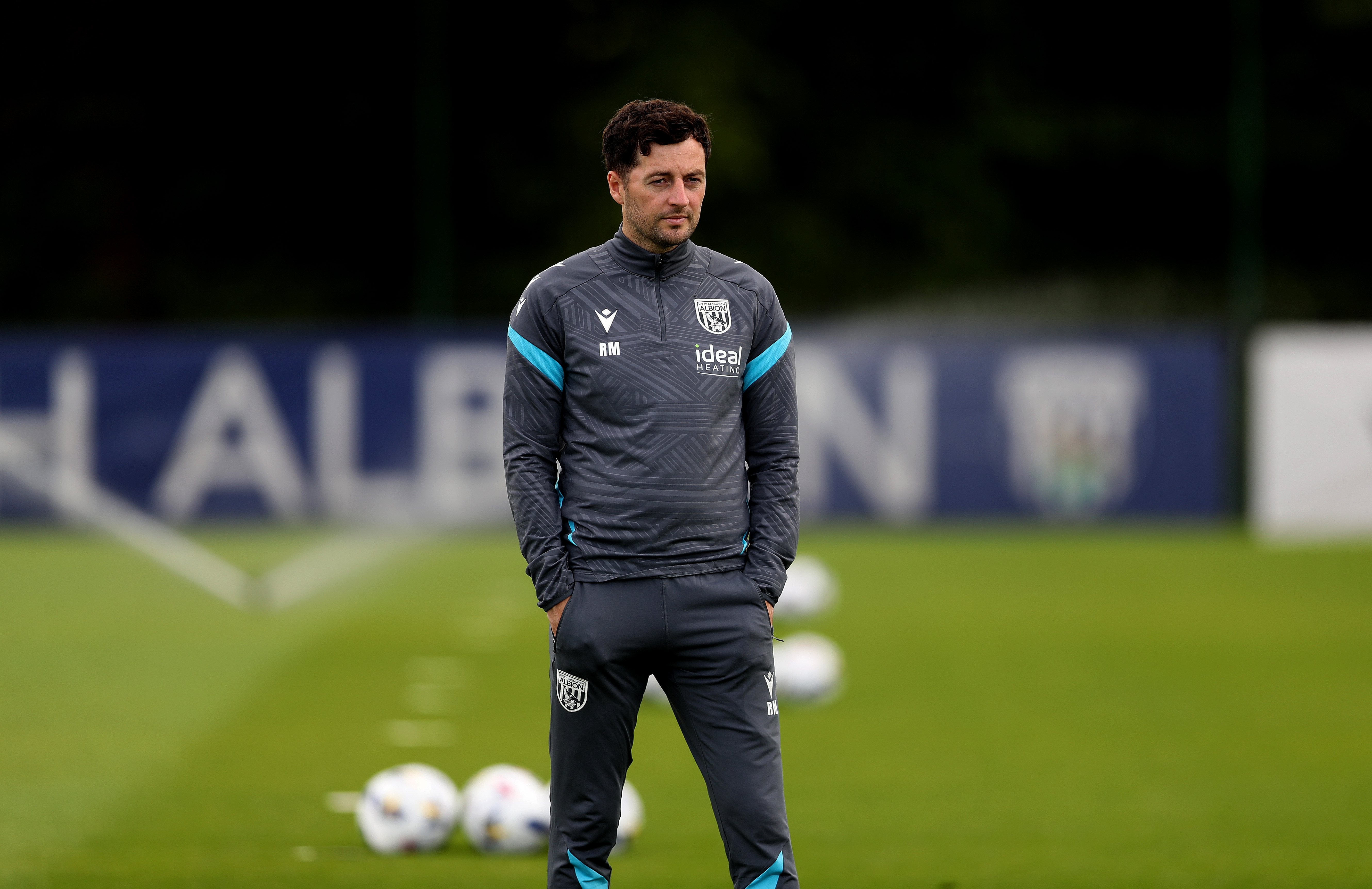 Ryan Mason watching training