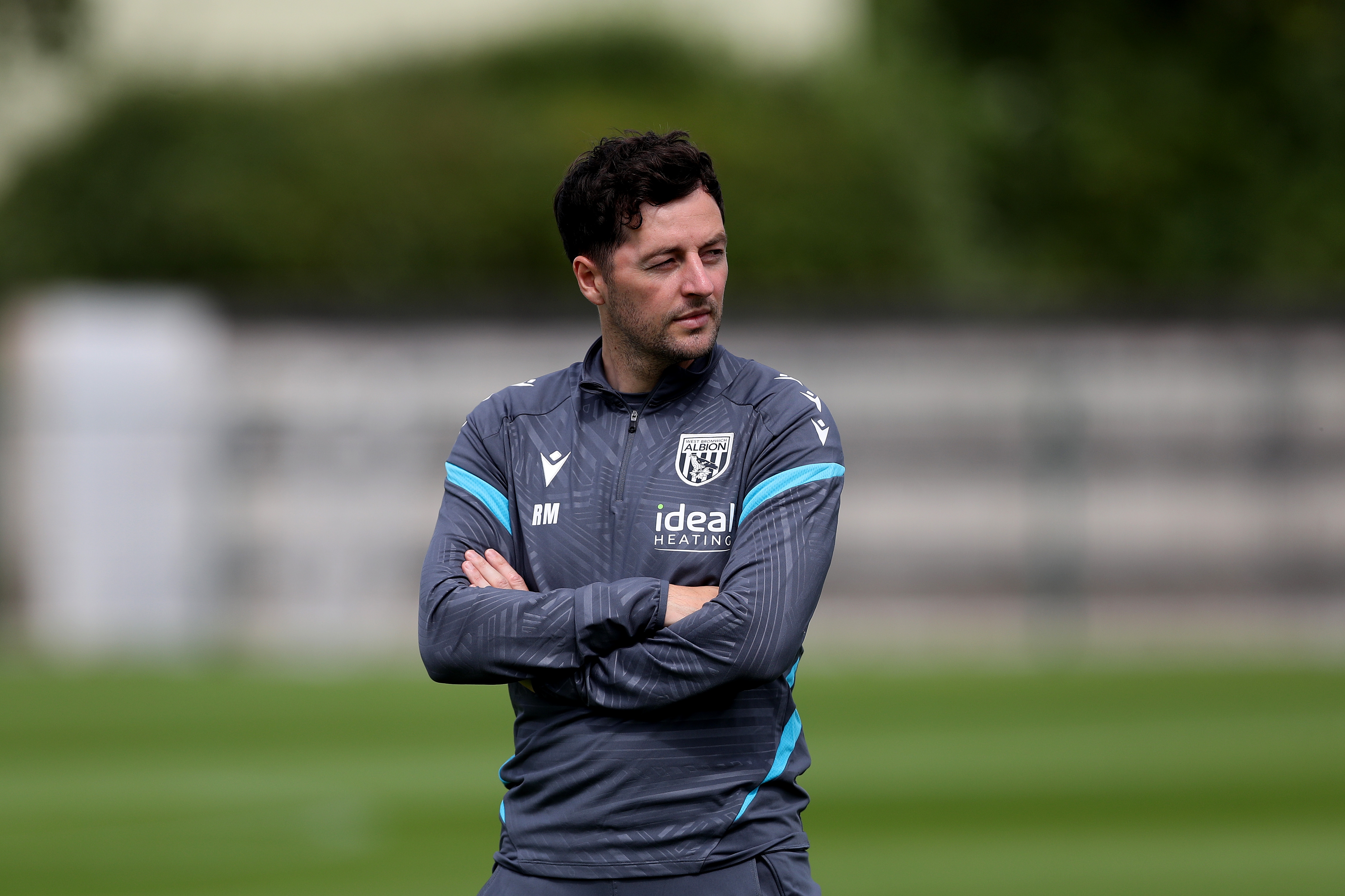 Ryan Mason watching training