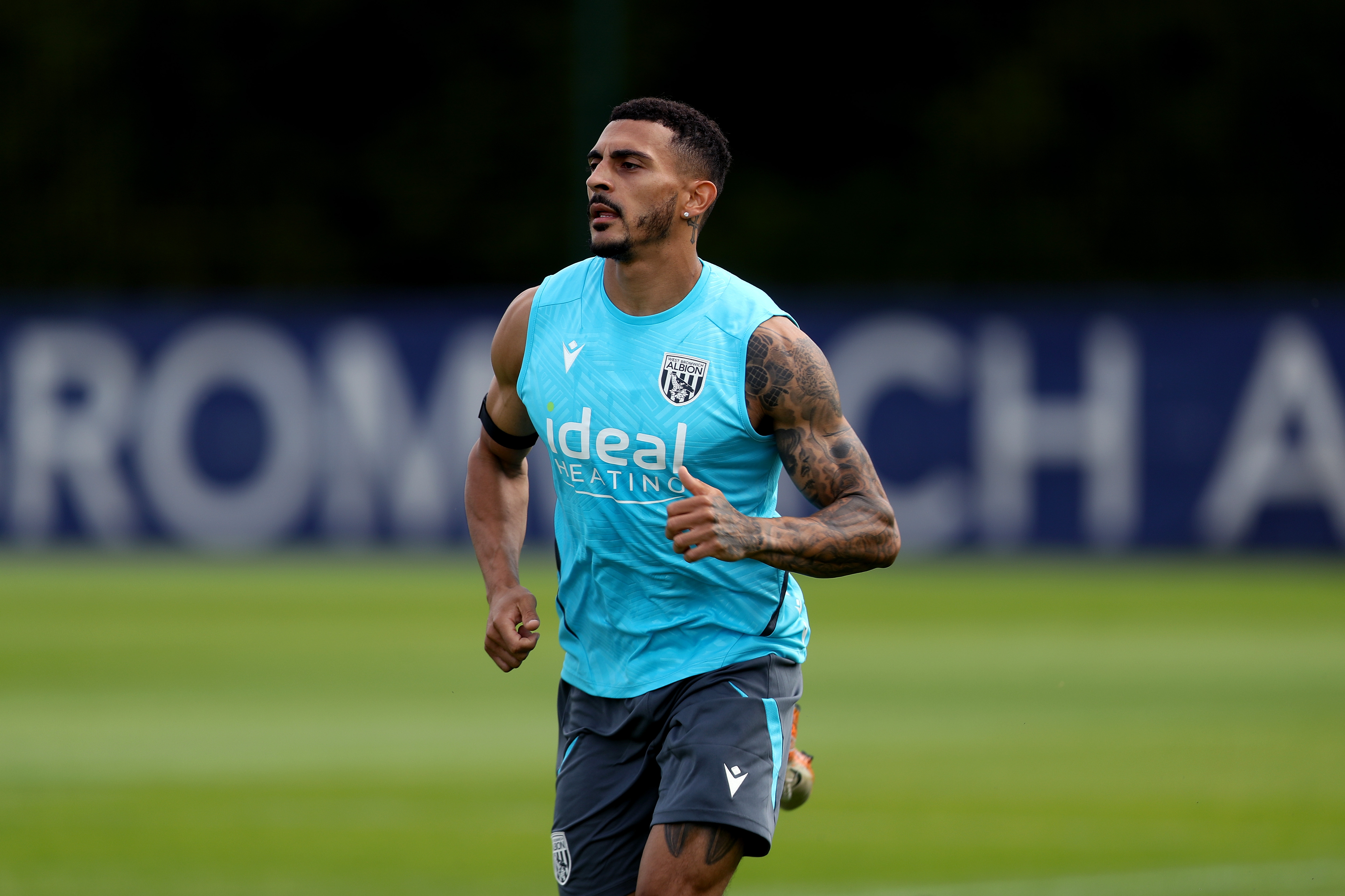 Karlan Grant running during a training session