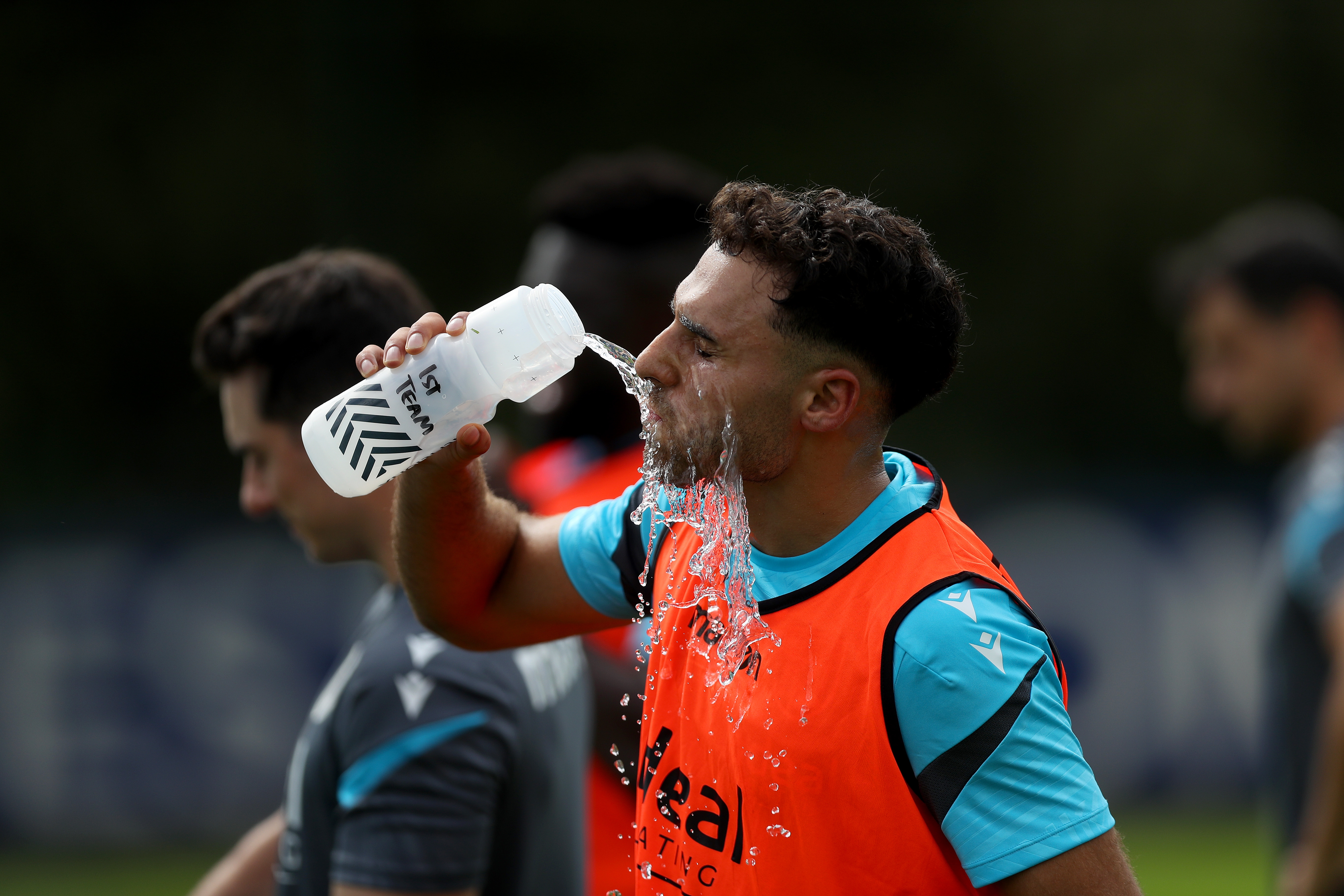Tammer Bany drinking water during a break in a training session