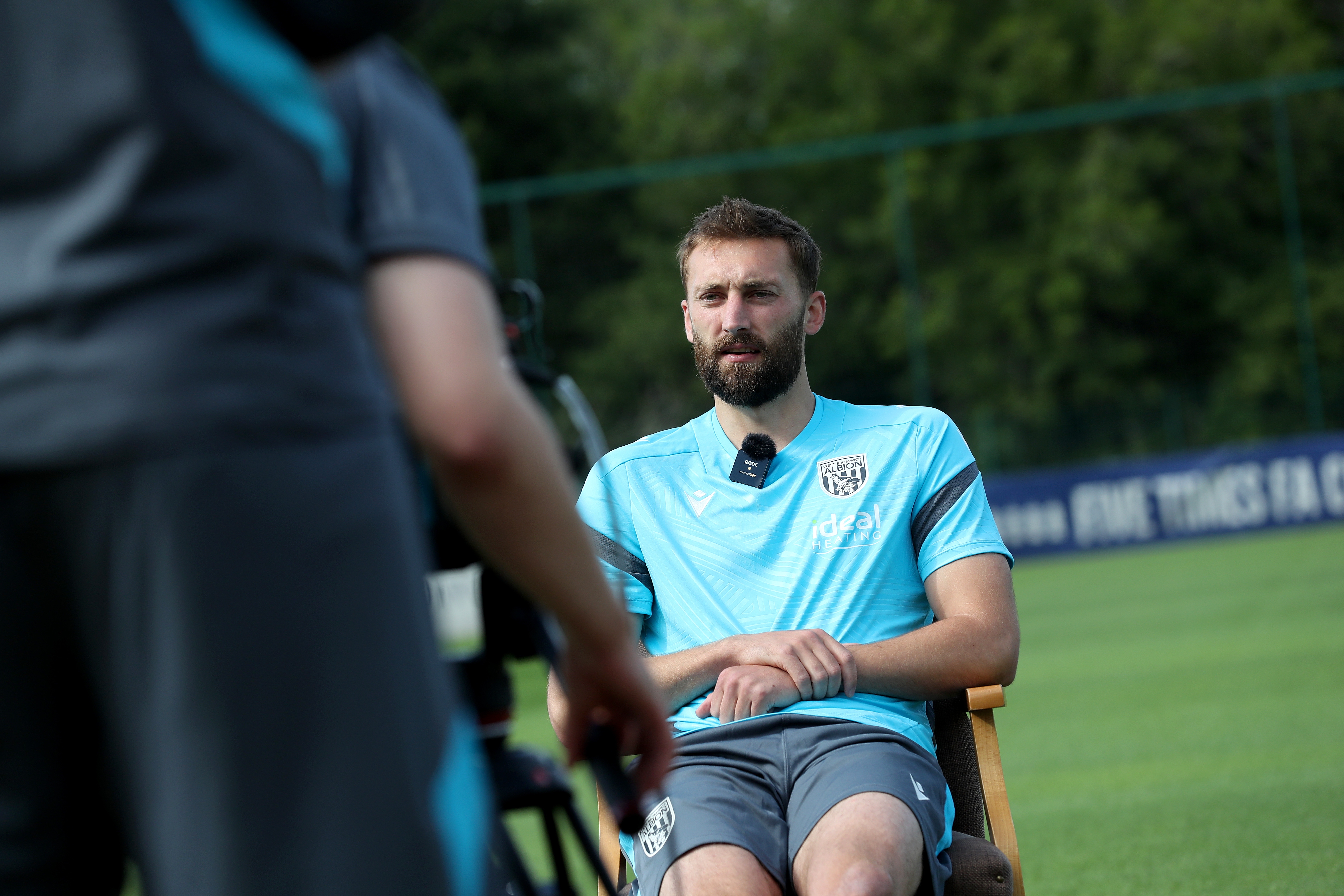 Nat Phillips is interviewed out on a training pitch