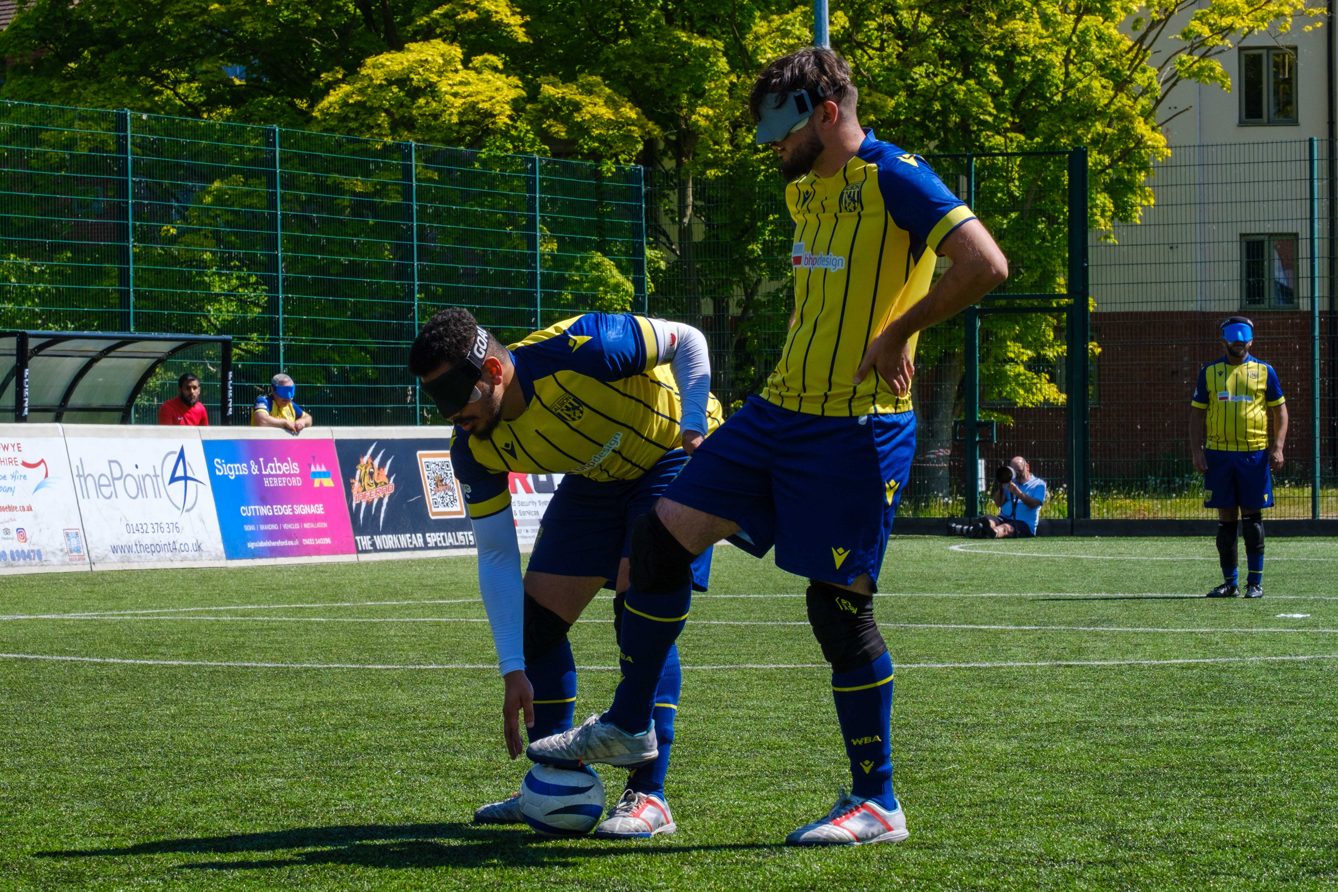 Mo Ahmed places the ball down for a free-kick.