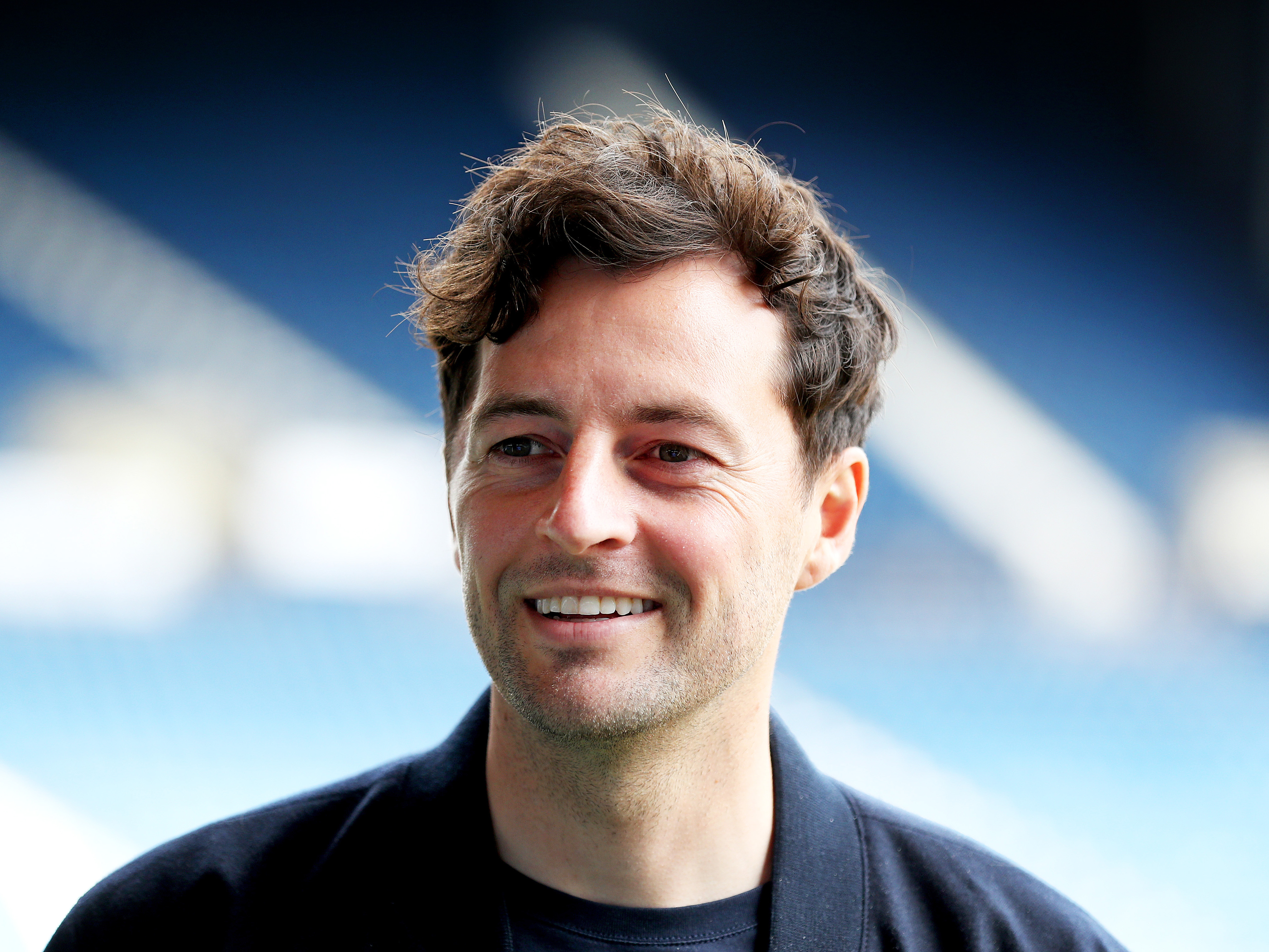 A photo of Albion Head Coach Ryan Mason smiling at The Hawthorns